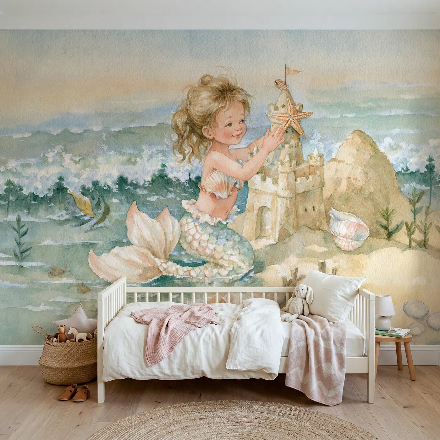 Watercolor mermaid building a sandcastle in the shallows, mural for a playroom by Whimsy Tots