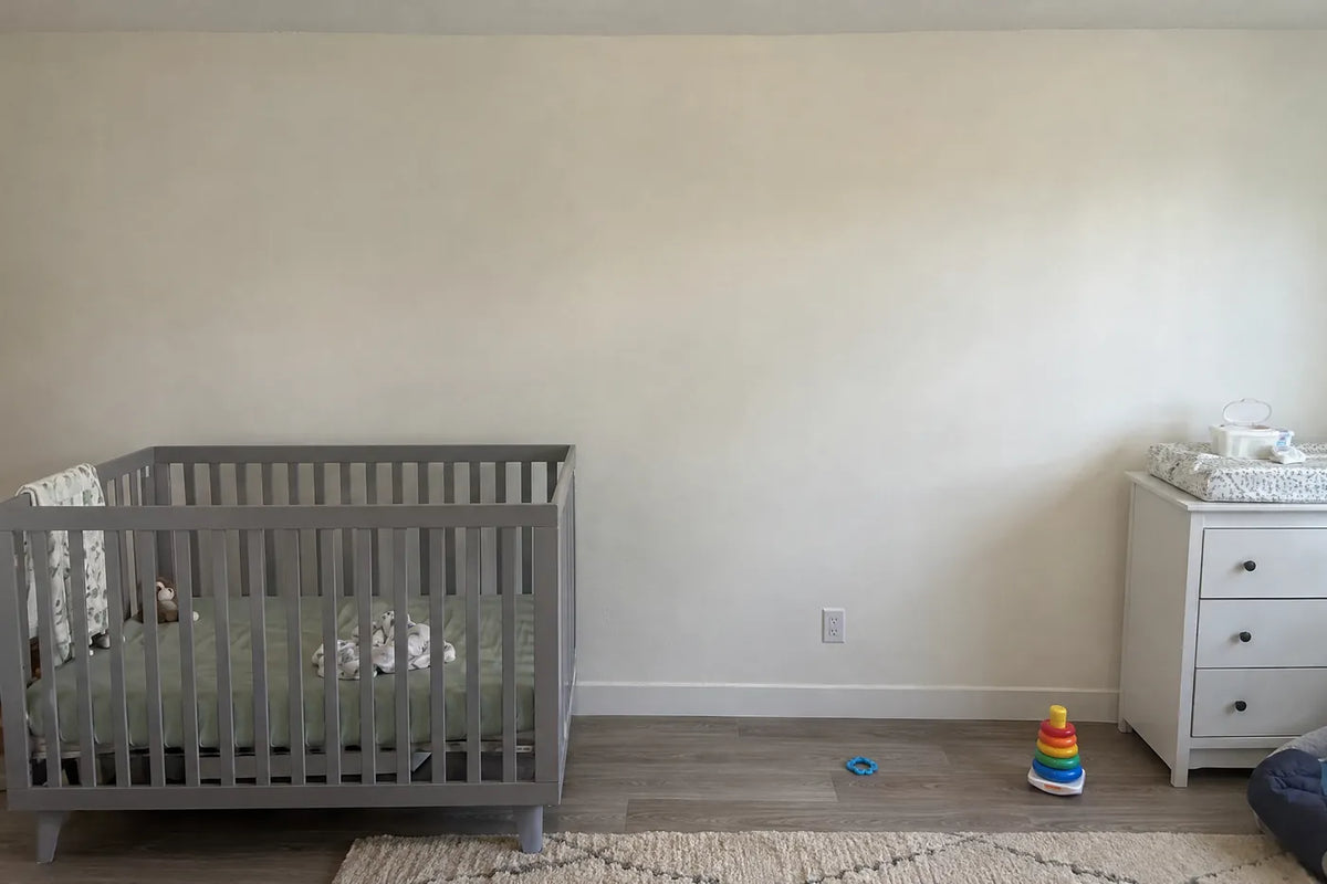 Watercolor wall mural of a baby elephant beside its mother at sunrise, the same room before, by Whimsy Tots
