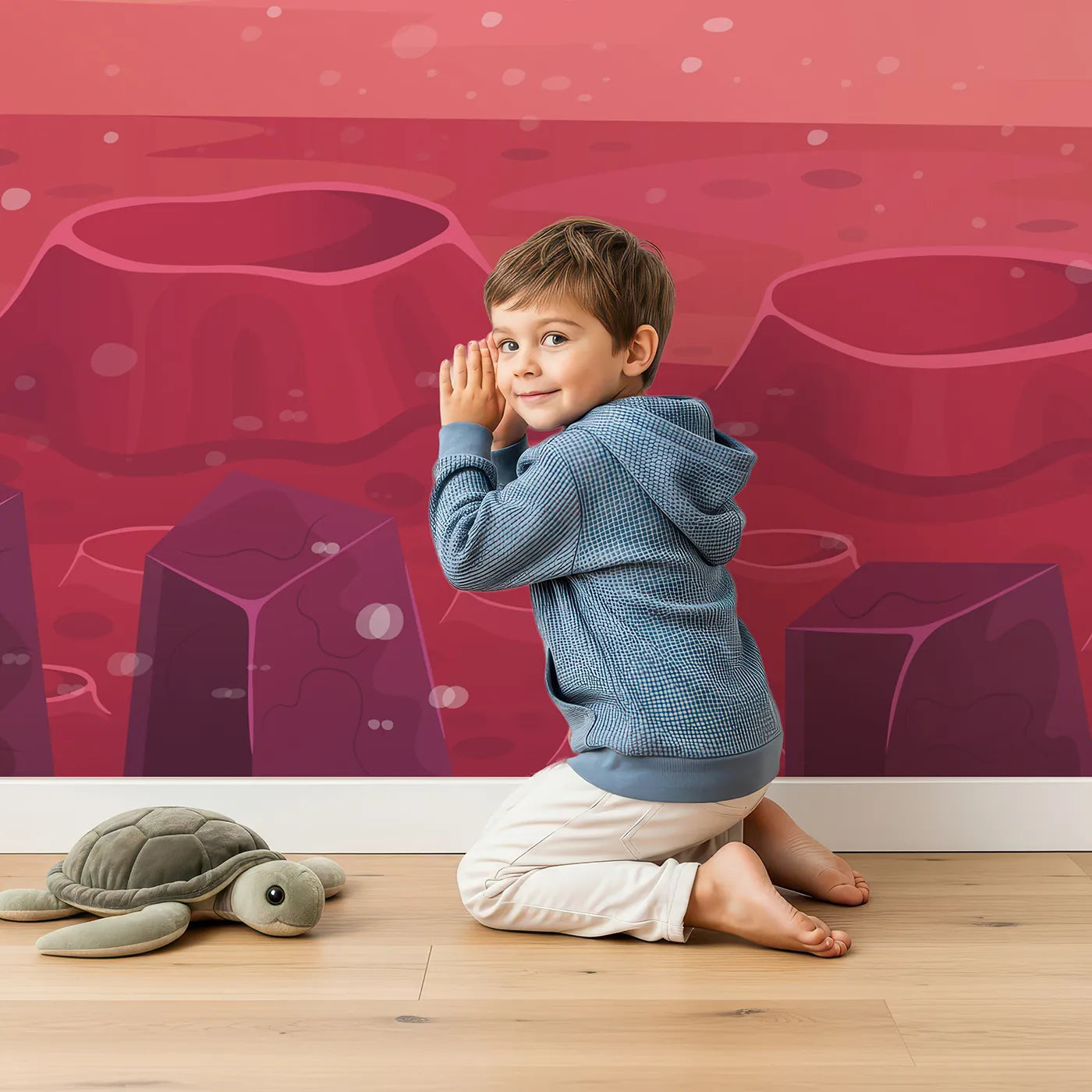 Child in front of Whimsy Tots Cosmic Craters Planet Wall Mural in Orange with planet, space, alien, rock, crater, moon, sky, landscape in design.