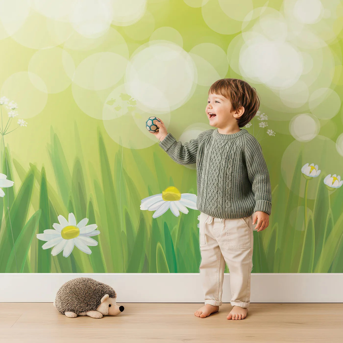 Child in front of Whimsy Tots Sunny Meadow Day Wall Mural with meadow, flower, daisy, sun, light, grass, nature, summer in design.