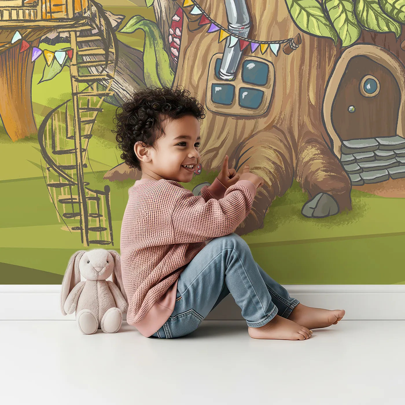 Child in front of Whimsy Tots Treehouse Adventure Wall Mural with treehouse, mushroom, village, fantasy, adventure, cartoon, forest, tree in design.