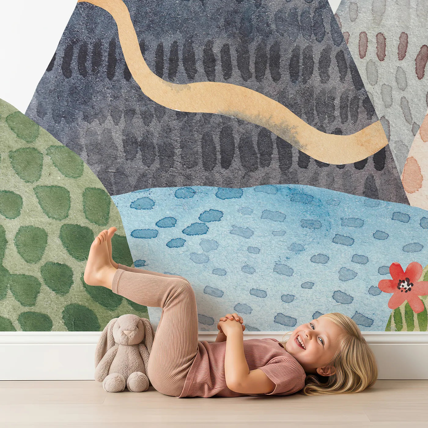 Child in front of Whimsy Tots Rainbow Mountain Wanderer Wall Mural with rainbow, mountain, watercolor, fox, tree, landscape, sun, magical in design.