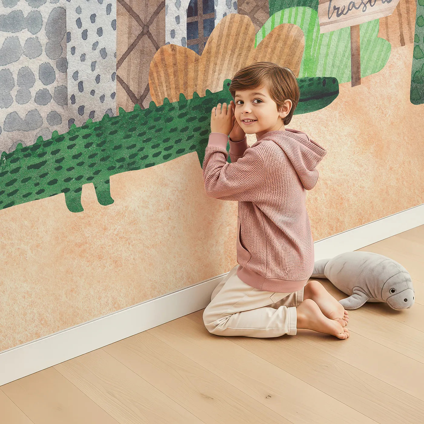 Child in front of Whimsy Tots Pirate Animal Adventure Wall Mural with pirate, dinosaur, animal, castle, treasure, island, elephant, adventure in design.