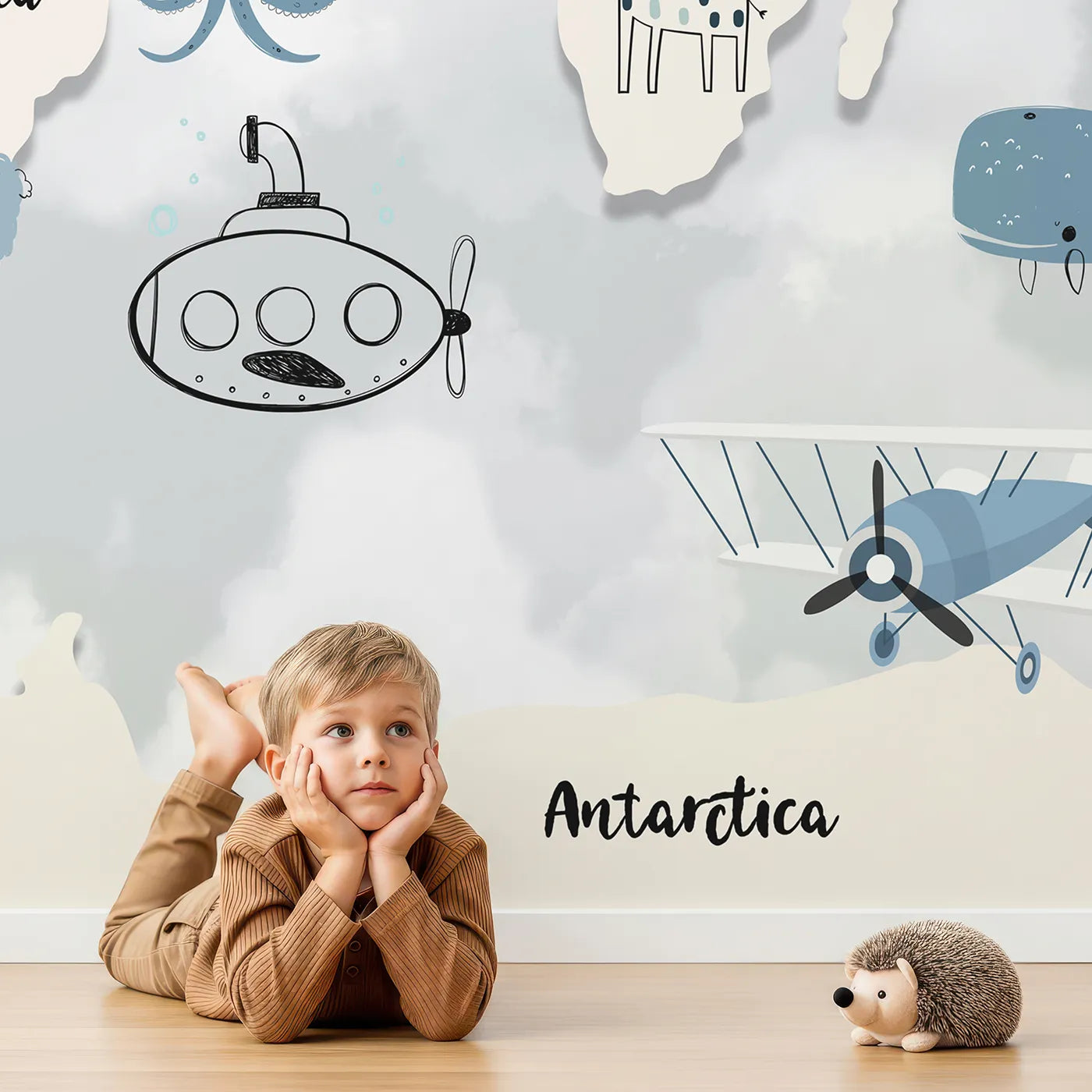Child in front of Whimsy Tots Blue Animal World Map Wall Mural with map, world, animal, blue, gray, cute, travel, ocean in design.