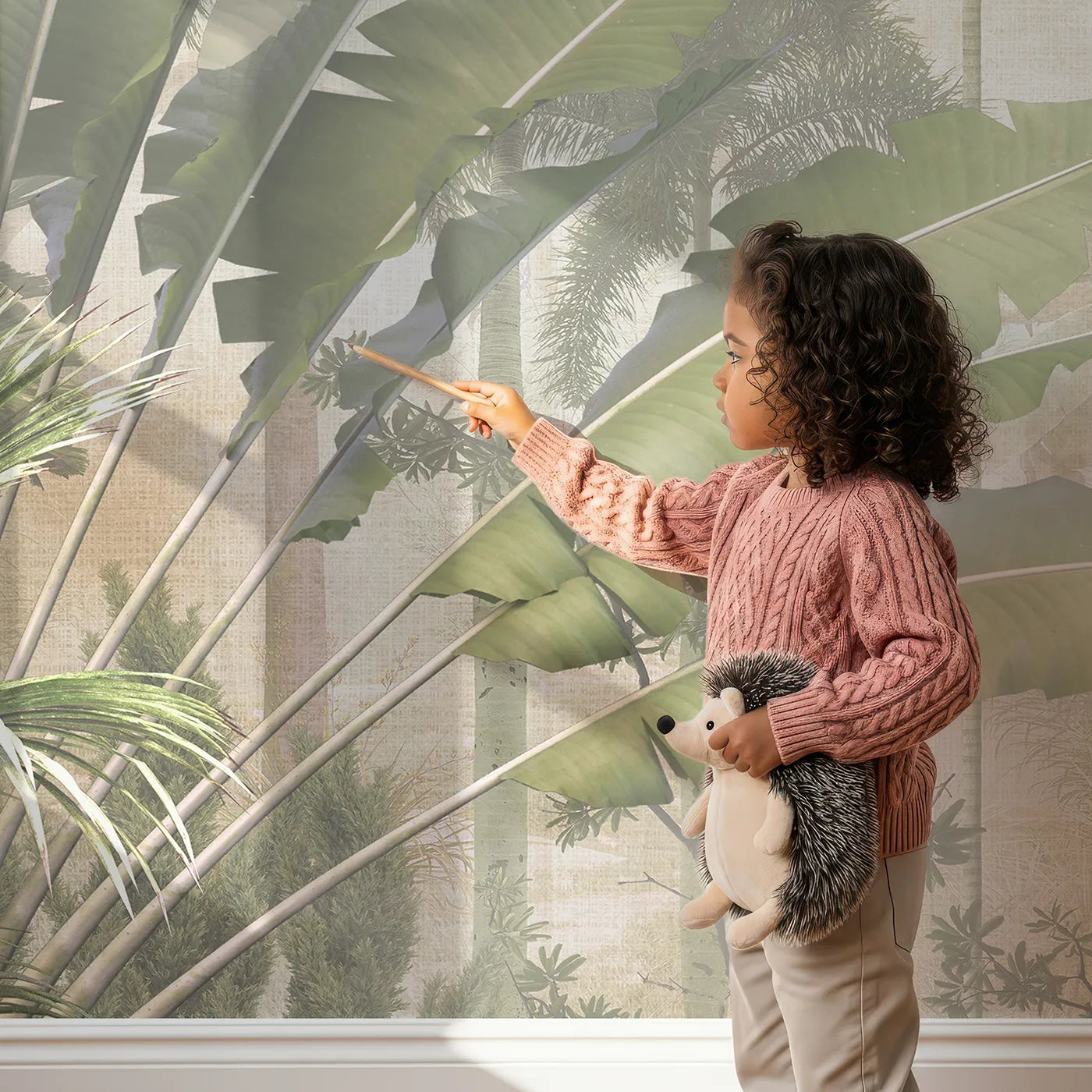 Child in front of Whimsy Tots Misty Tropical Jungle Wall Mural with jungle, tropical, mist, palm tree, forest, realistic, beige, green in design.
