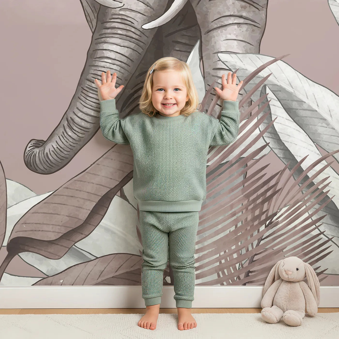 Child in front of Whimsy Tots Dusty Rose Safari Wall Mural with safari, animal, pink, elephant, zebra, jungle, tropical, modern in design.