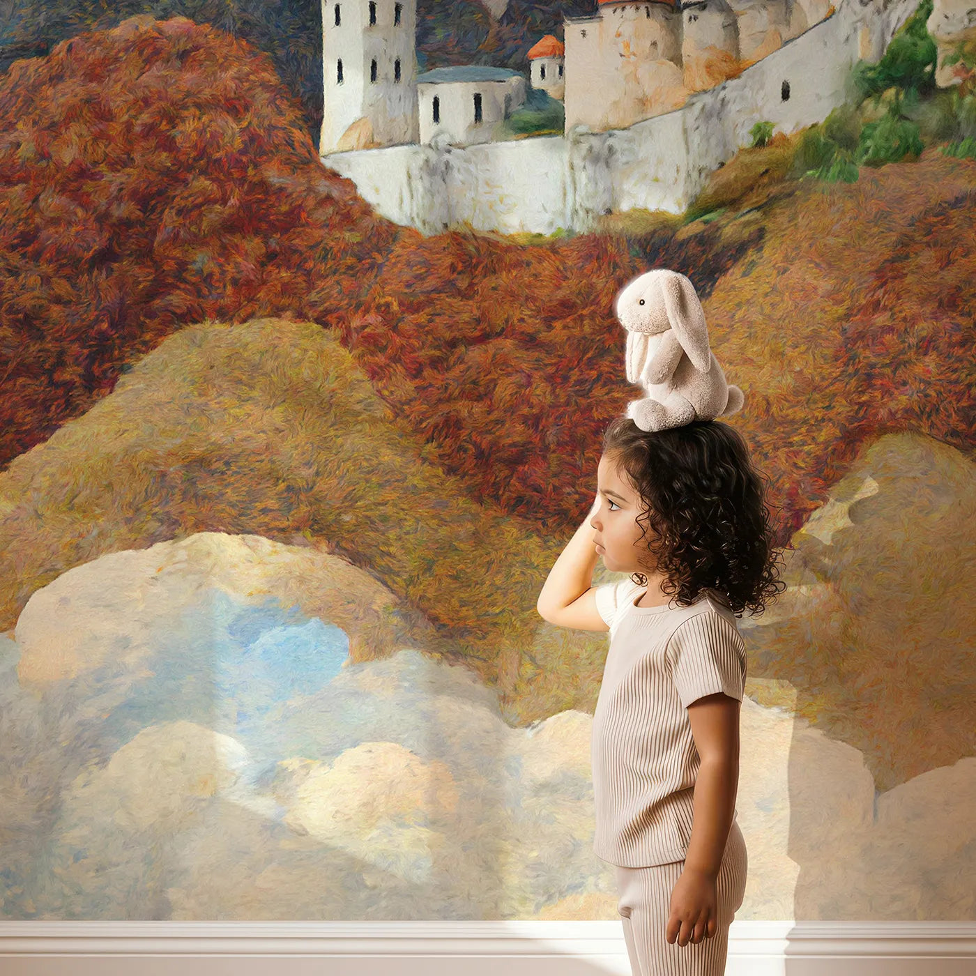 Child in front of Whimsy Tots Dragonwatch Peaks Castle Wall Mural with dragon, castle, mountain, fantasy, painterly, clouds, adventure, epic in design.