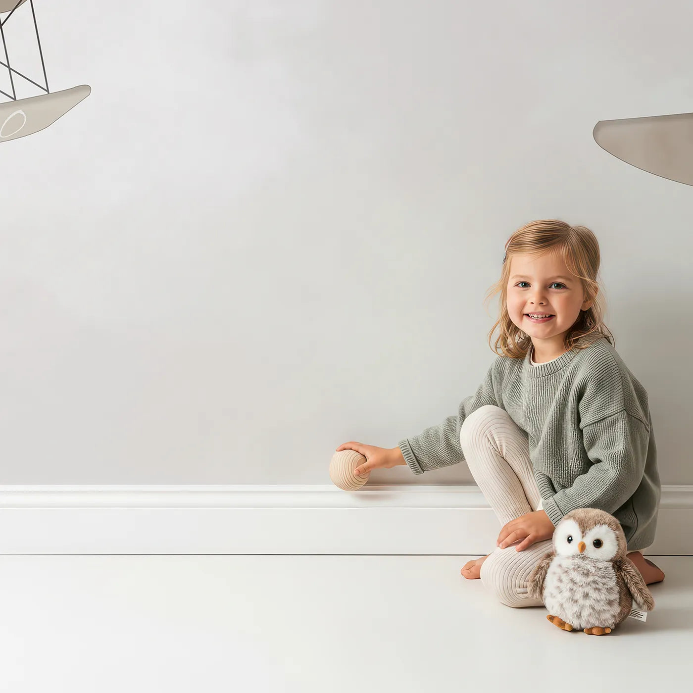 Child in front of Whimsy Tots Safari Aviators Wall Mural with animal, airplane, safari, cute, giraffe, elephant, panda, vintage in design.
