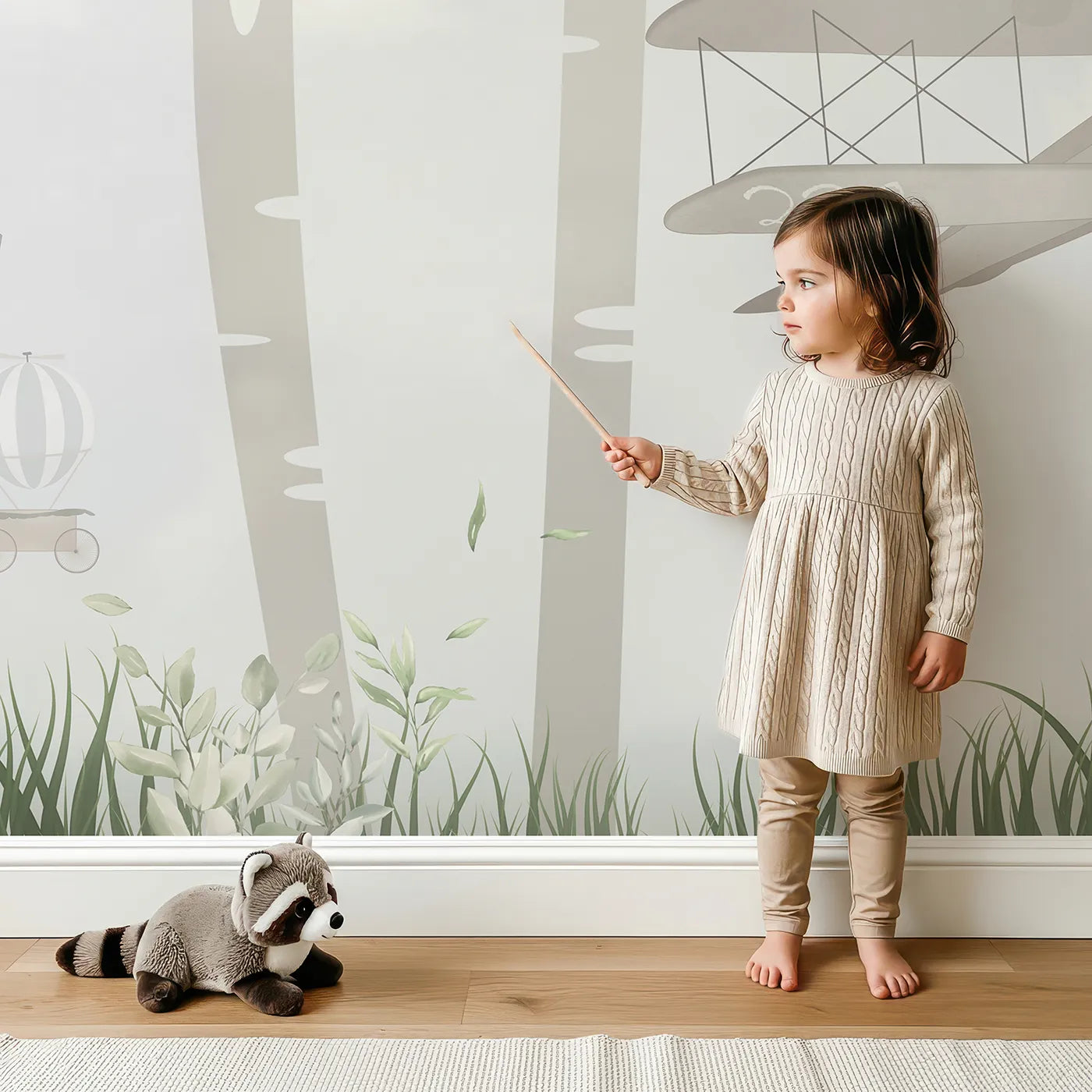 Child in front of Whimsy Tots Woodland Aviators Wall Mural with animal, forest, airplane, misty, cute, safari, woodland, gray in design.