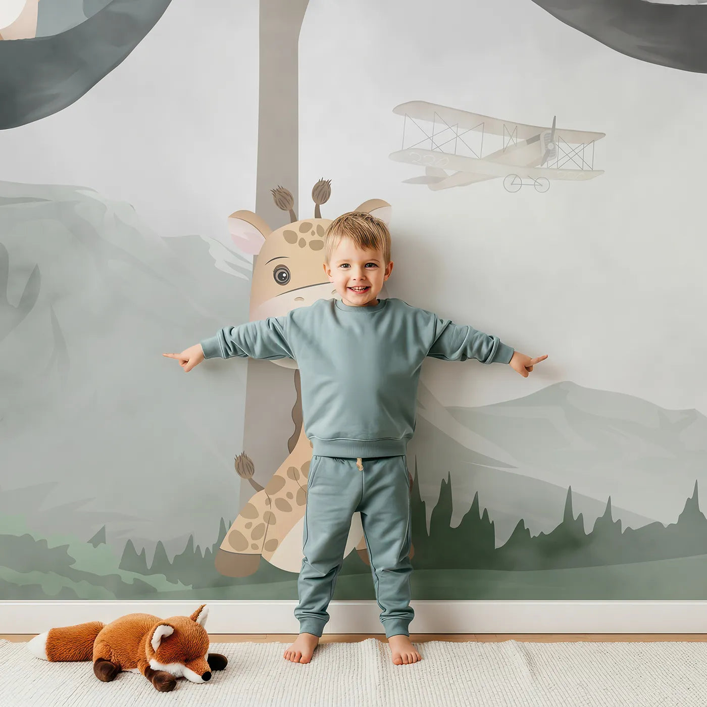Child in front of Whimsy Tots Woodland Friends Hangout Wall Mural with animal, forest, hammock, cute, misty, gray, safari, woodland in design.