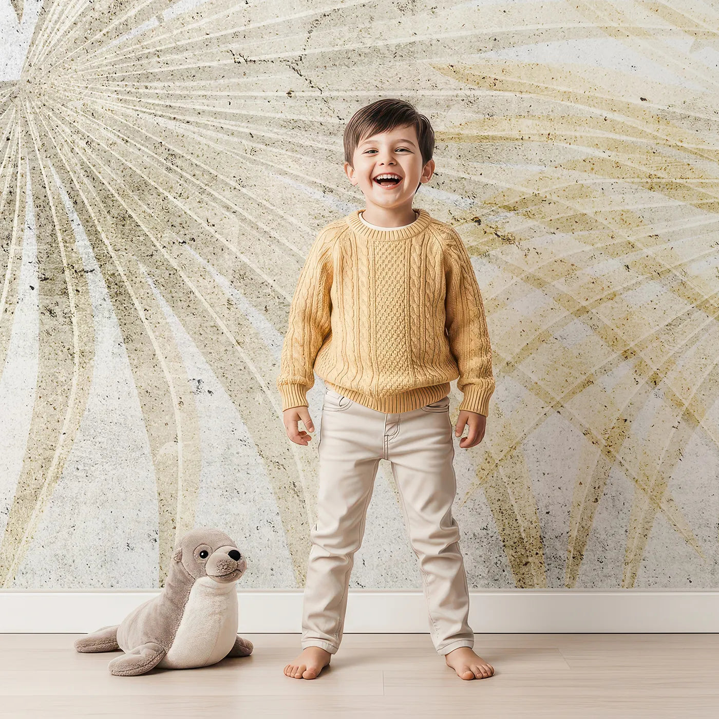 Child in front of Whimsy Tots Golden Fan Palms Wall Mural with palm, leaf, tropical, gold, beige, fan palm, modern, boho in design.
