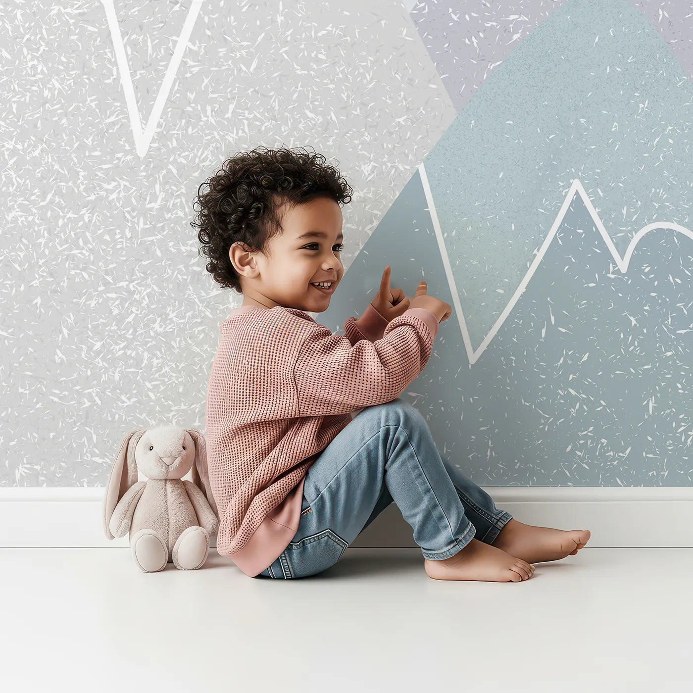 Child in front of Whimsy Tots Textured Mountain Balloons Wall Mural with mountain, balloon, abstract, texture, modern, gray, blue, pink in design.