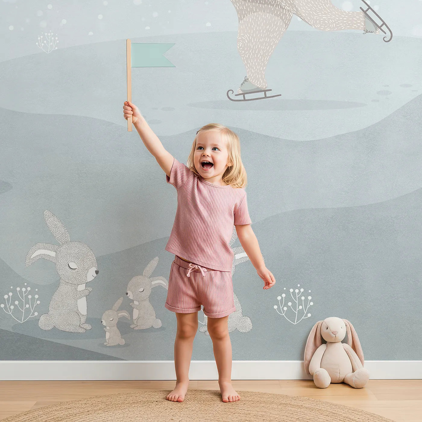 Child in front of Whimsy Tots Winter Games in the Woods Wall Mural with bear, winter, snow, cute, animal, mountain, skate, whimsical in design.