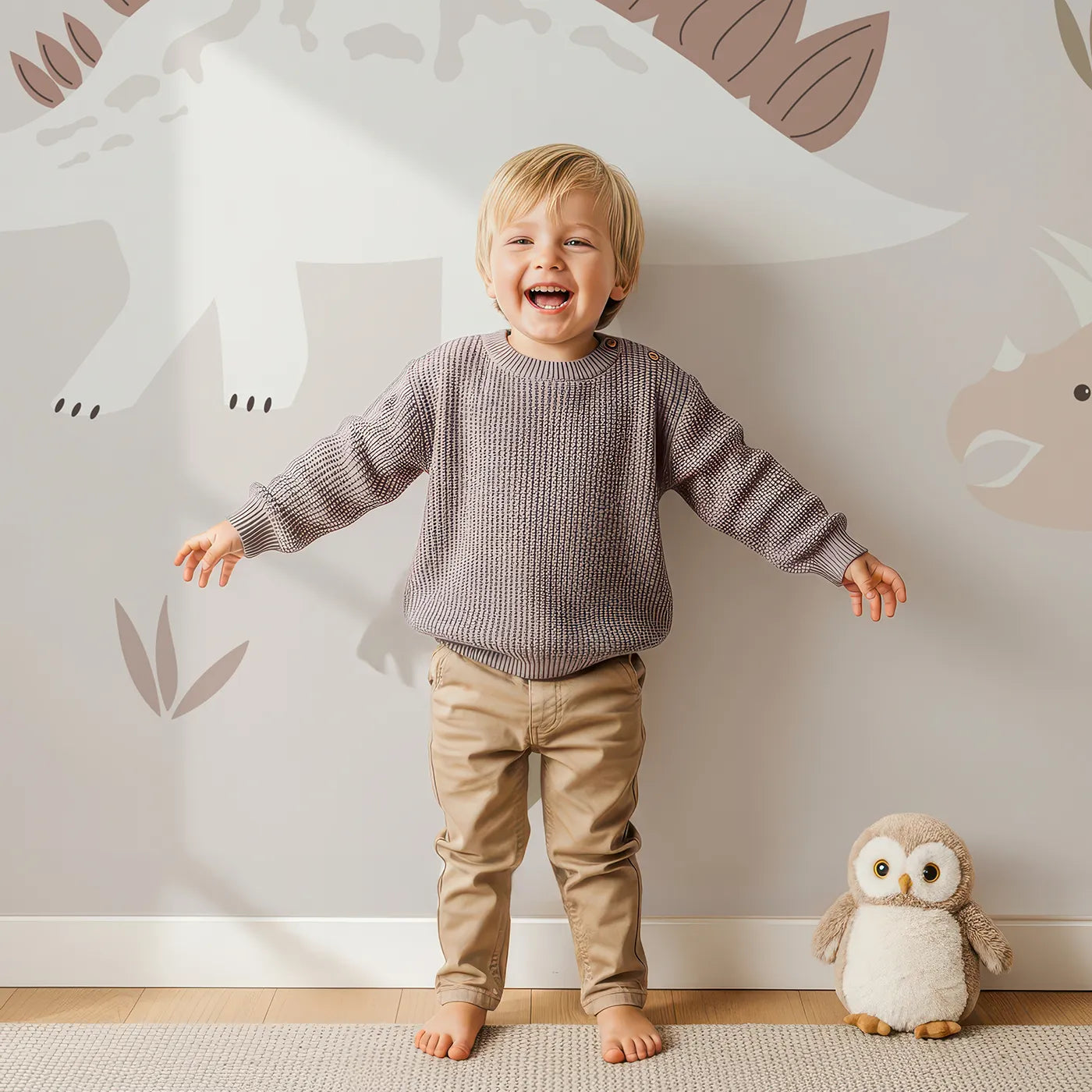 Child in front of Whimsy Tots Neutral Dinosaur Valley Wall Mural with dinosaur, prehistoric, neutral, beige, modern, volcano, minimalist, cute in design.