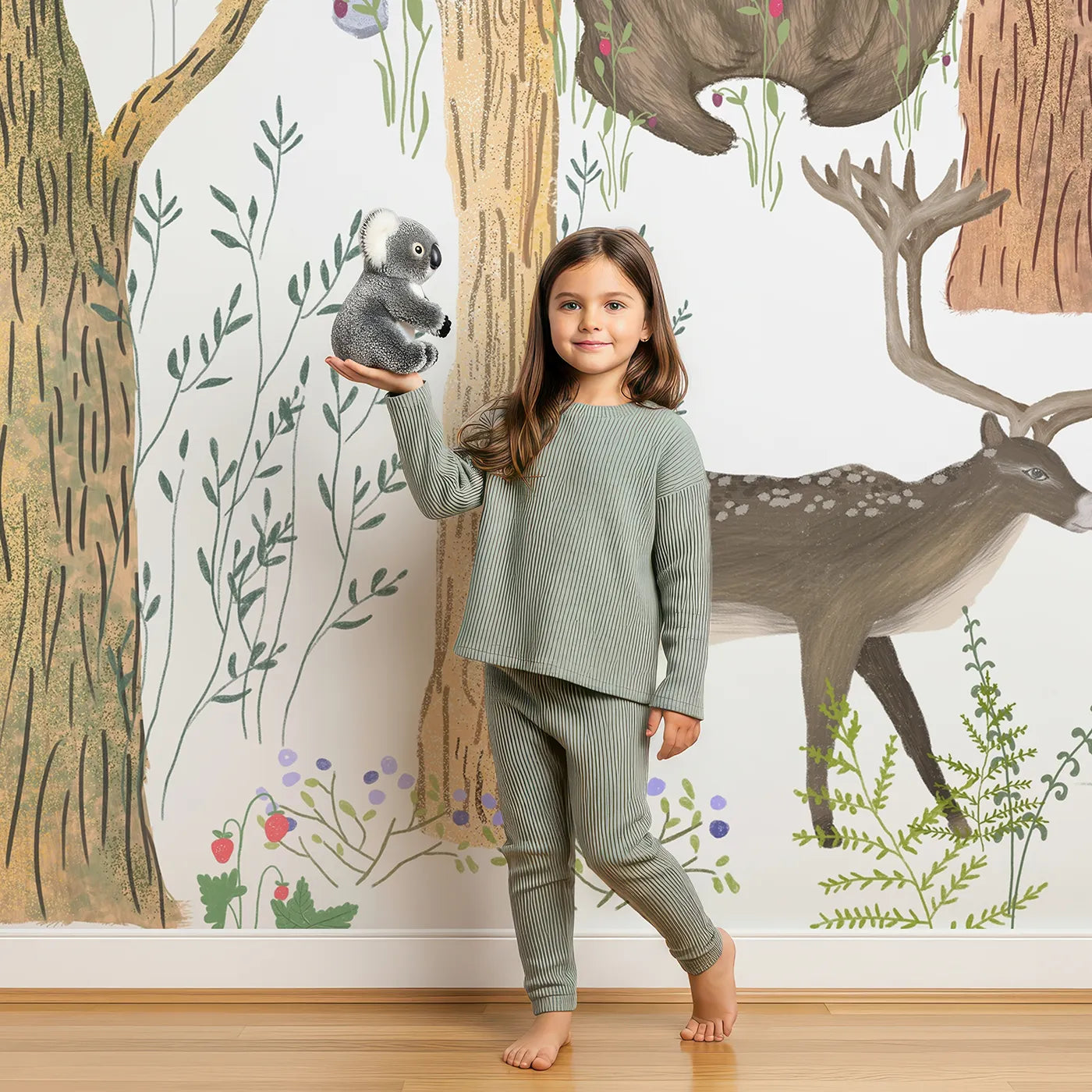 Child in front of Whimsy Tots Detailed Woodland Forest Wall Mural with woodland, animal, forest, drawing, sketch, bear, deer, fox in design.