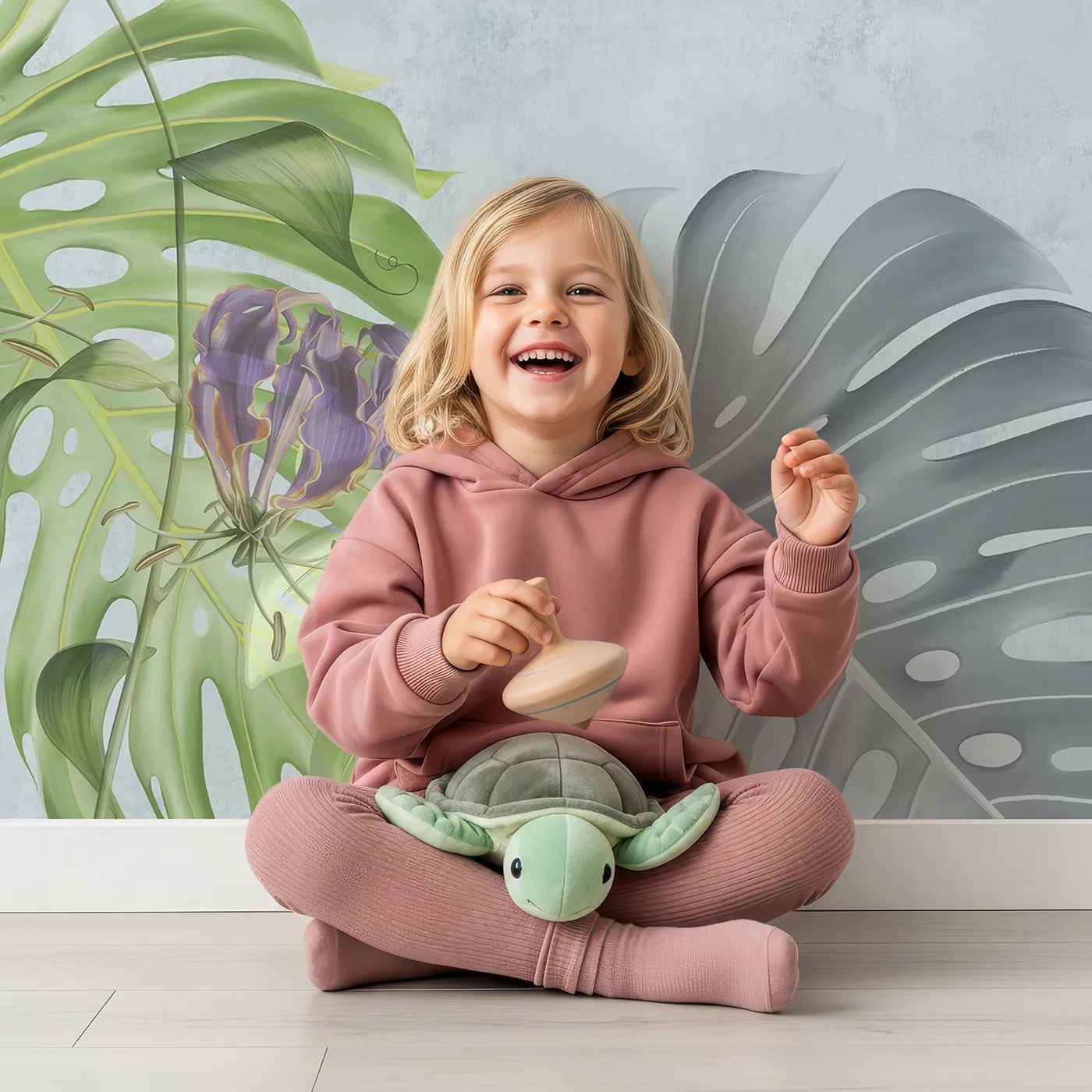 Child in front of Whimsy Tots Exotic Garden Wall Mural with flower, botanical, tropical, jungle, exotic, passion flower, monstera, vibrant in design.