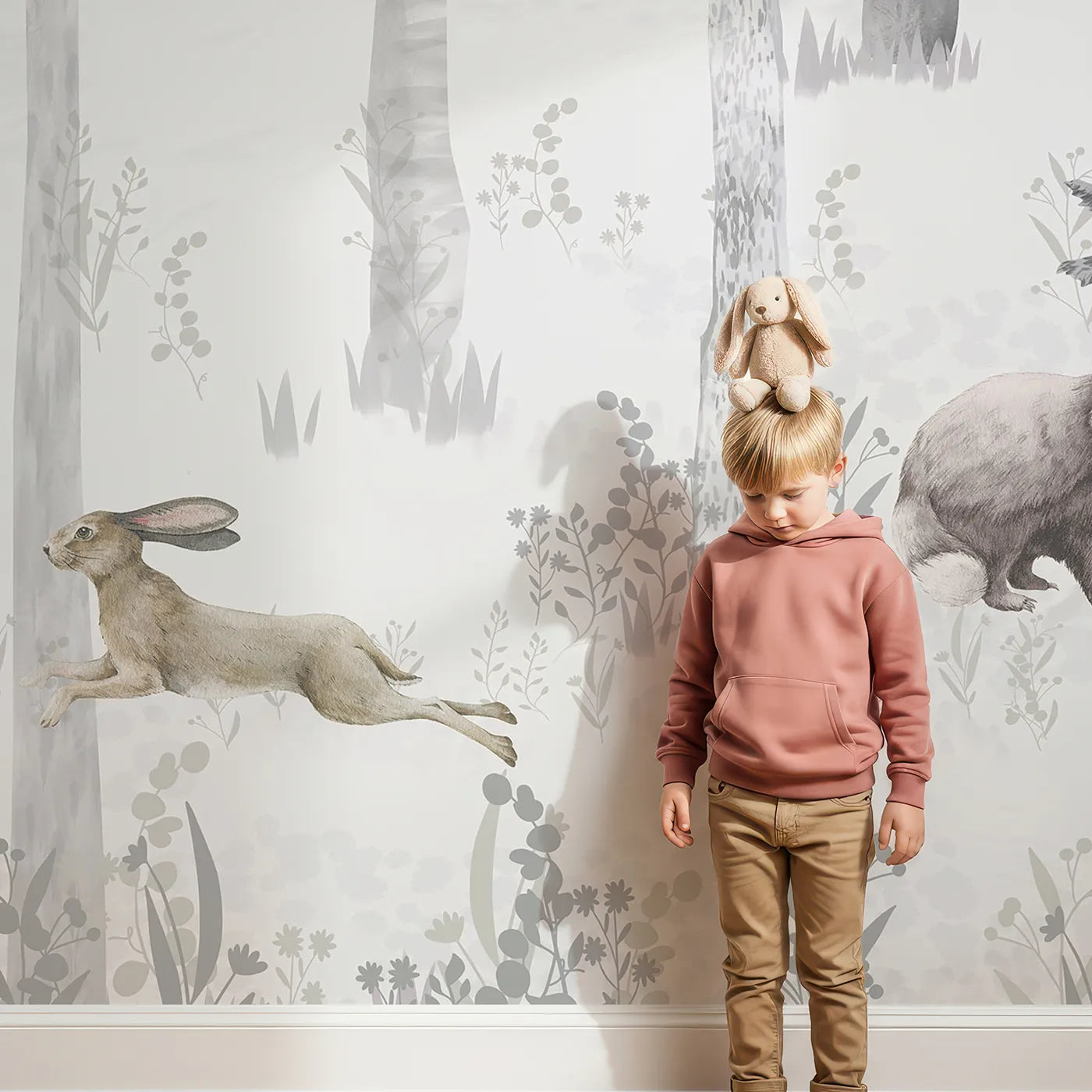 Child in front of Whimsy Tots Misty Winter Woods Wall Mural with woodland, animal, forest, winter, mist, snow, bear, deer in design.