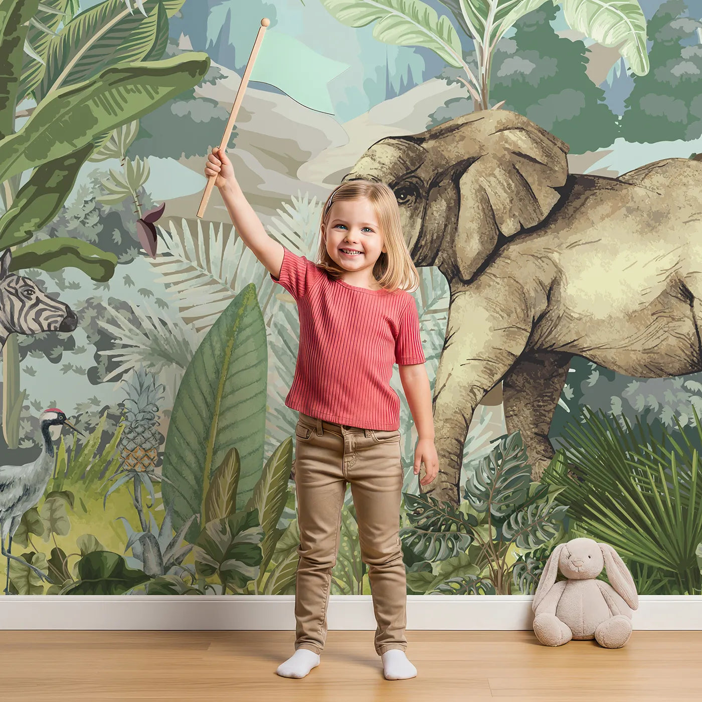 Child in front of Whimsy Tots Vintage Safari Panorama Wall Mural with jungle, safari, vintage, animal, giraffe, zebra, elephant, tropical in design.