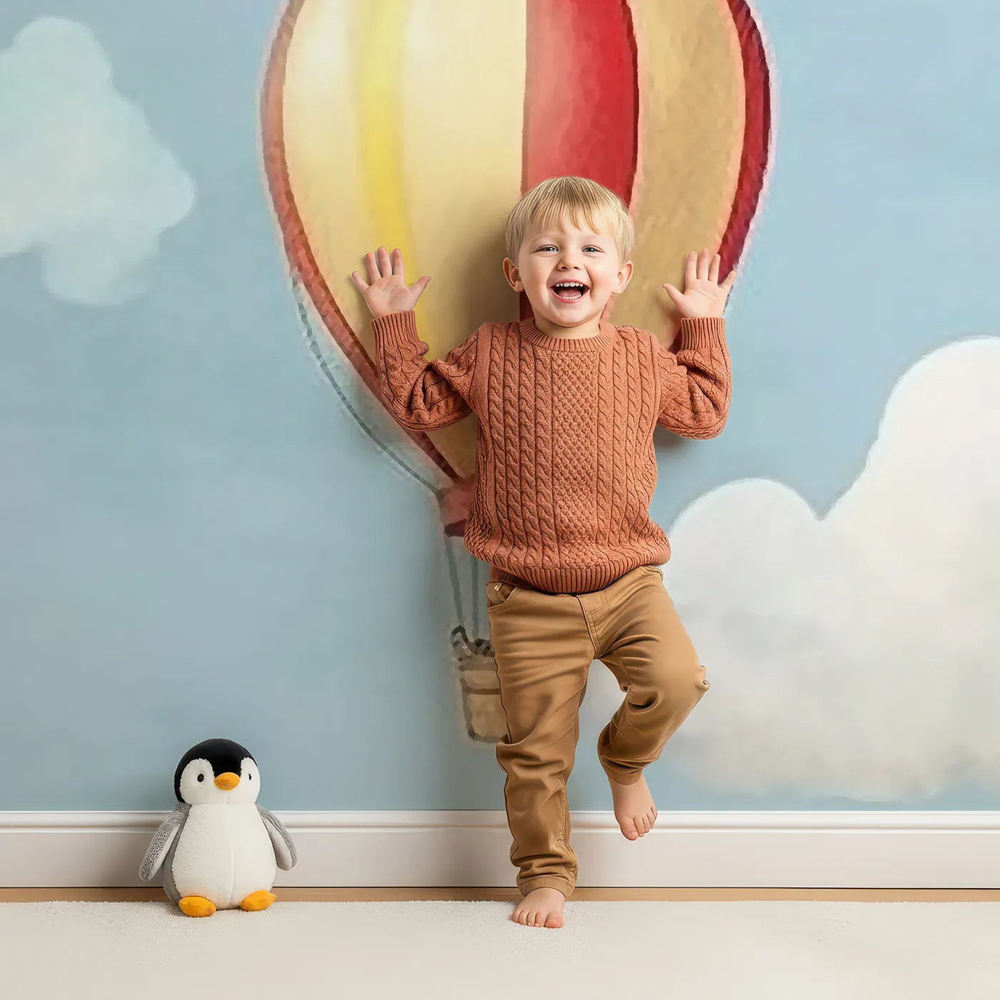 Child in front of Whimsy Tots Watercolor Hot Air Balloons Wall Mural with hot air balloon, balloon, sky, watercolor, cloud, colorful, pattern, cute in design.