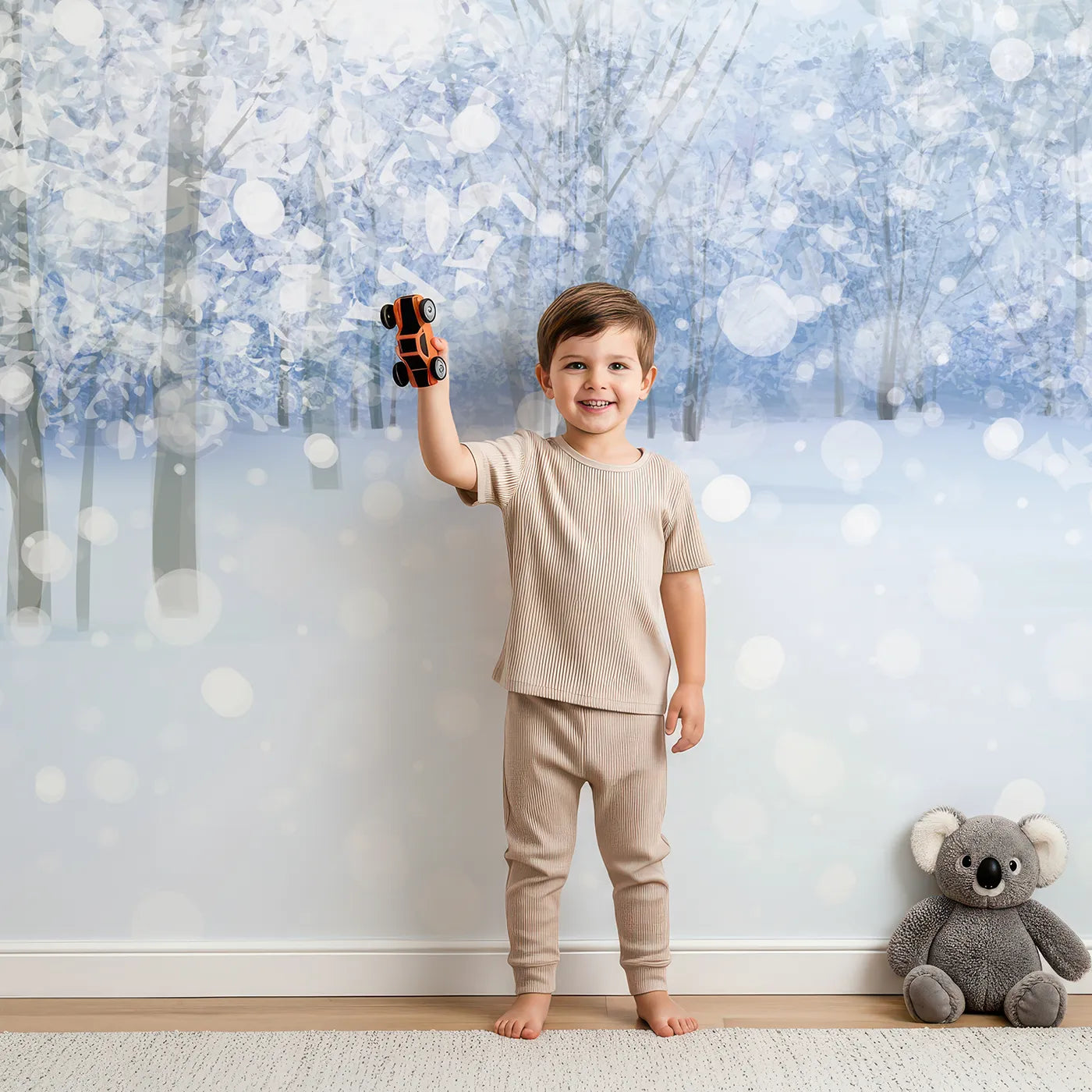 Child in front of Whimsy Tots Sparkling Winter Forest Wall Mural with winter, snow, forest, tree, sparkle, light, woods, magical in design.