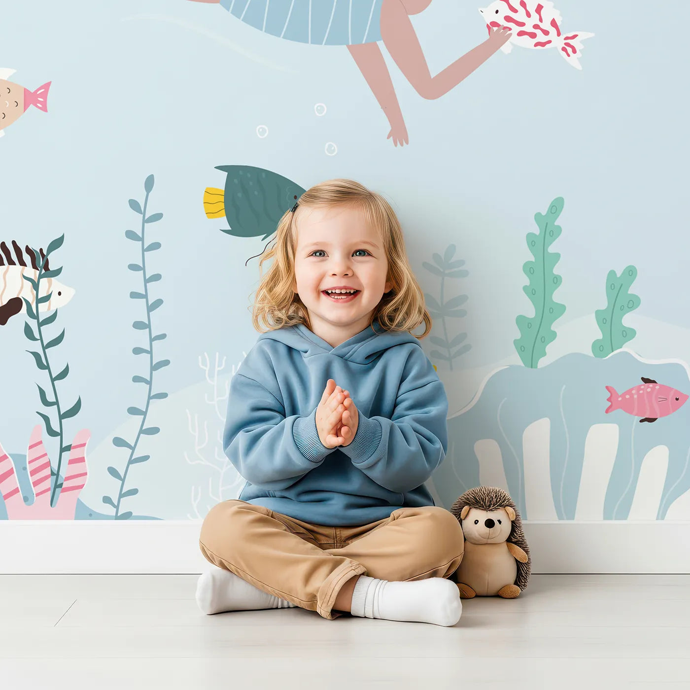 Child in front of Whimsy Tots Summer Swim Wall Mural with sea, ocean, swim, beach, summer, sun, turtle, fish in design.