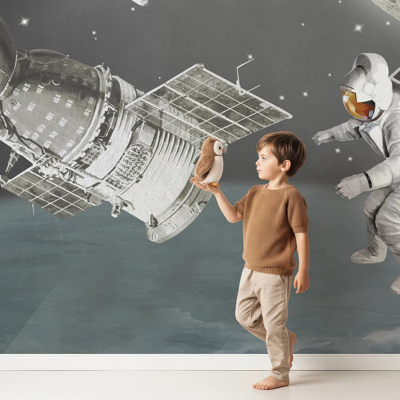 Child in front of Whimsy Tots Vintage Space Walk Wall Mural with space, astronaut, moon, retro, vintage, collage, spaceship, science in design.