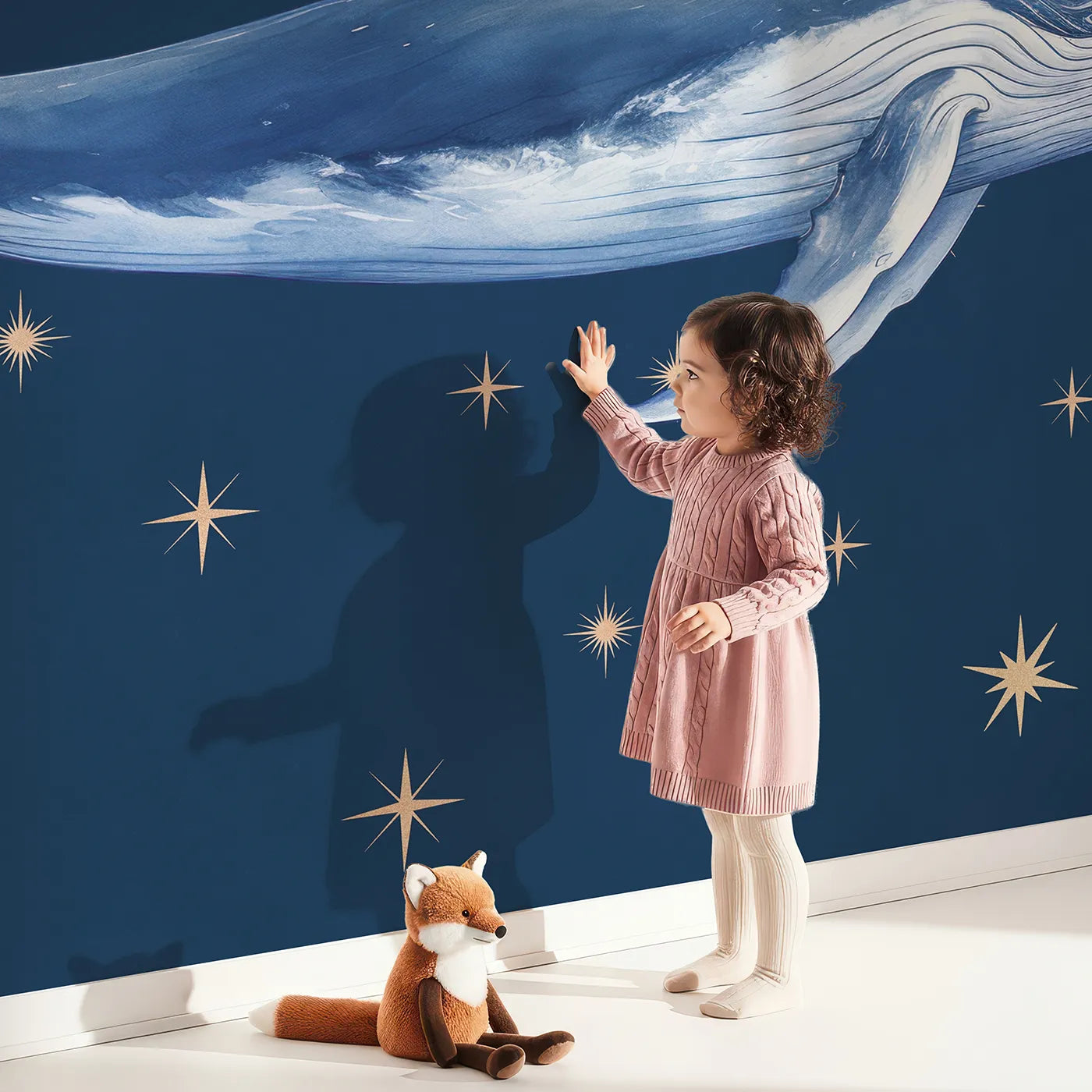 Child in front of Whimsy Tots Starry Whale Wall Mural with whale, star, space, night, cute, blue, cosmic, magical in design.