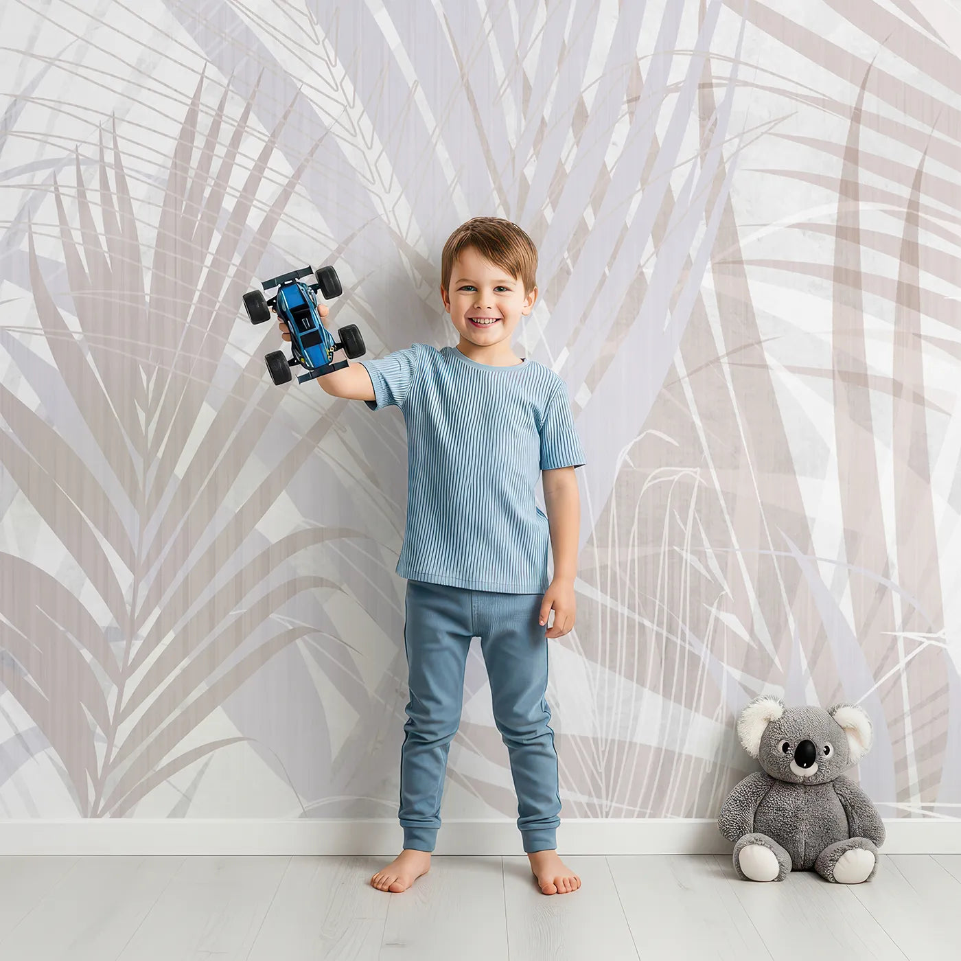 Child in front of Whimsy Tots Pastel Palm Leaves Wall Mural with tropical, palm, leaf, pastel, pink, gray, abstract, modern in design.