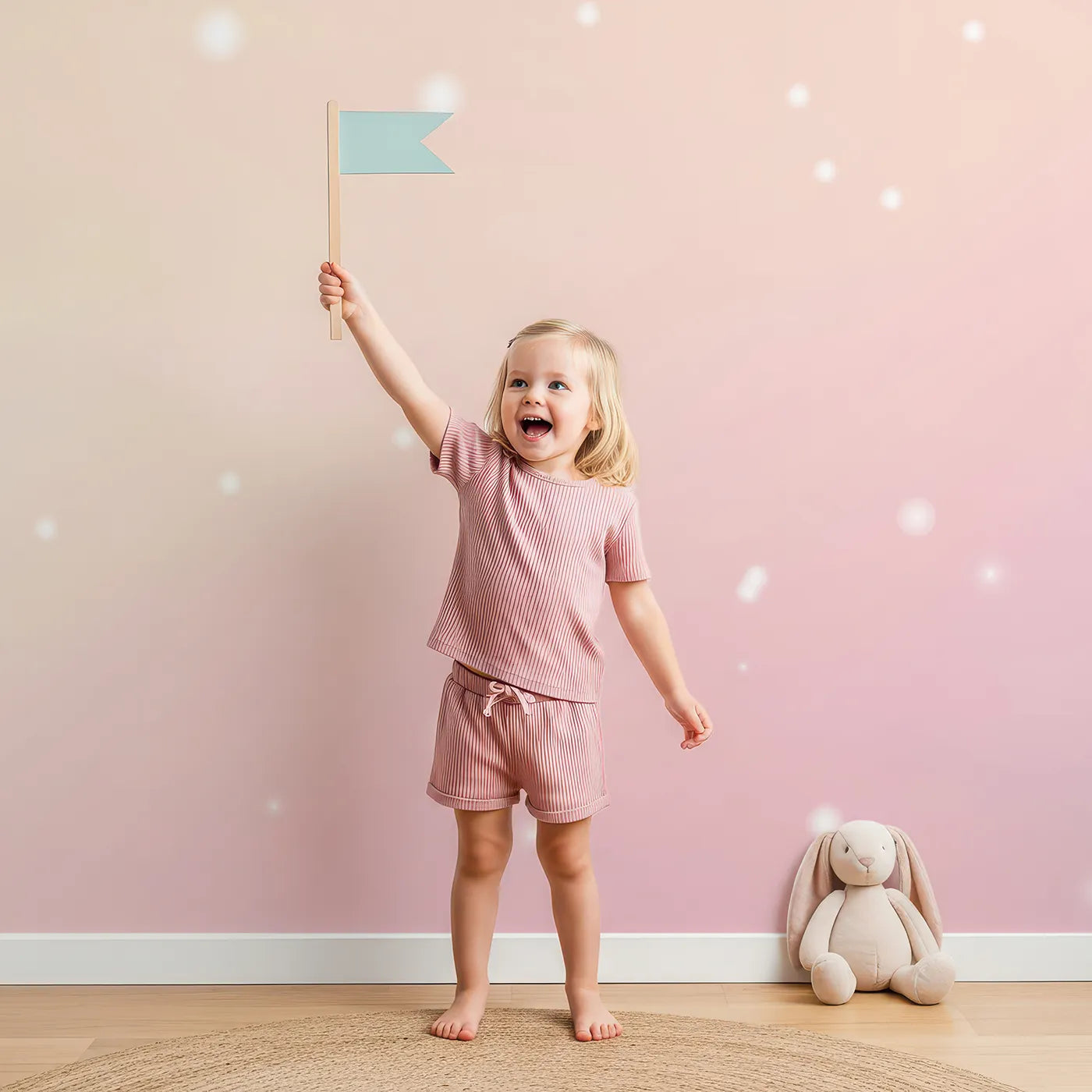 Child in front of Whimsy Tots Pastel Dream Cloud Wall Mural with pastel, abstract, watercolor, sky, pink, blue, cloud, sparkle in design.