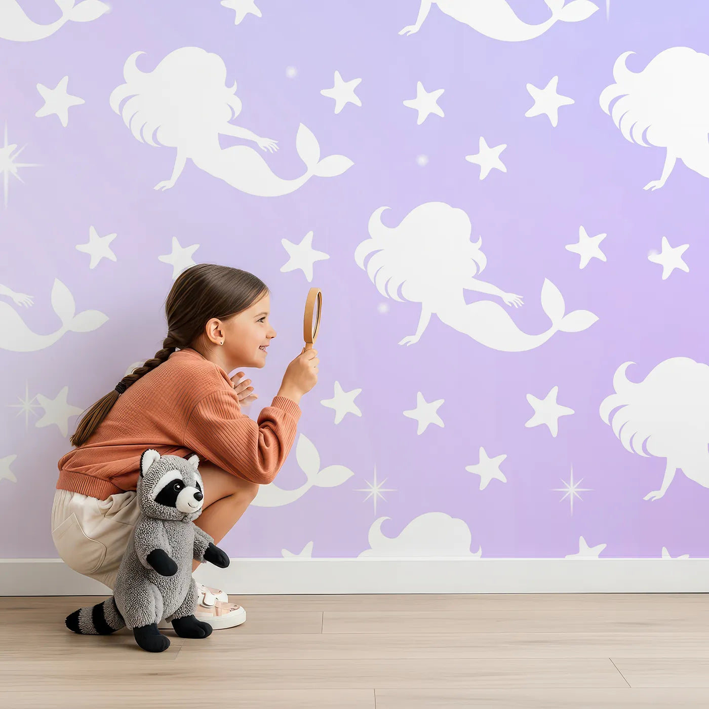Child in front of Whimsy Tots Mermaid Sparkle Wall Mural with mermaid, sparkle, pastel, rainbow, star, purple, blue, pink in design.