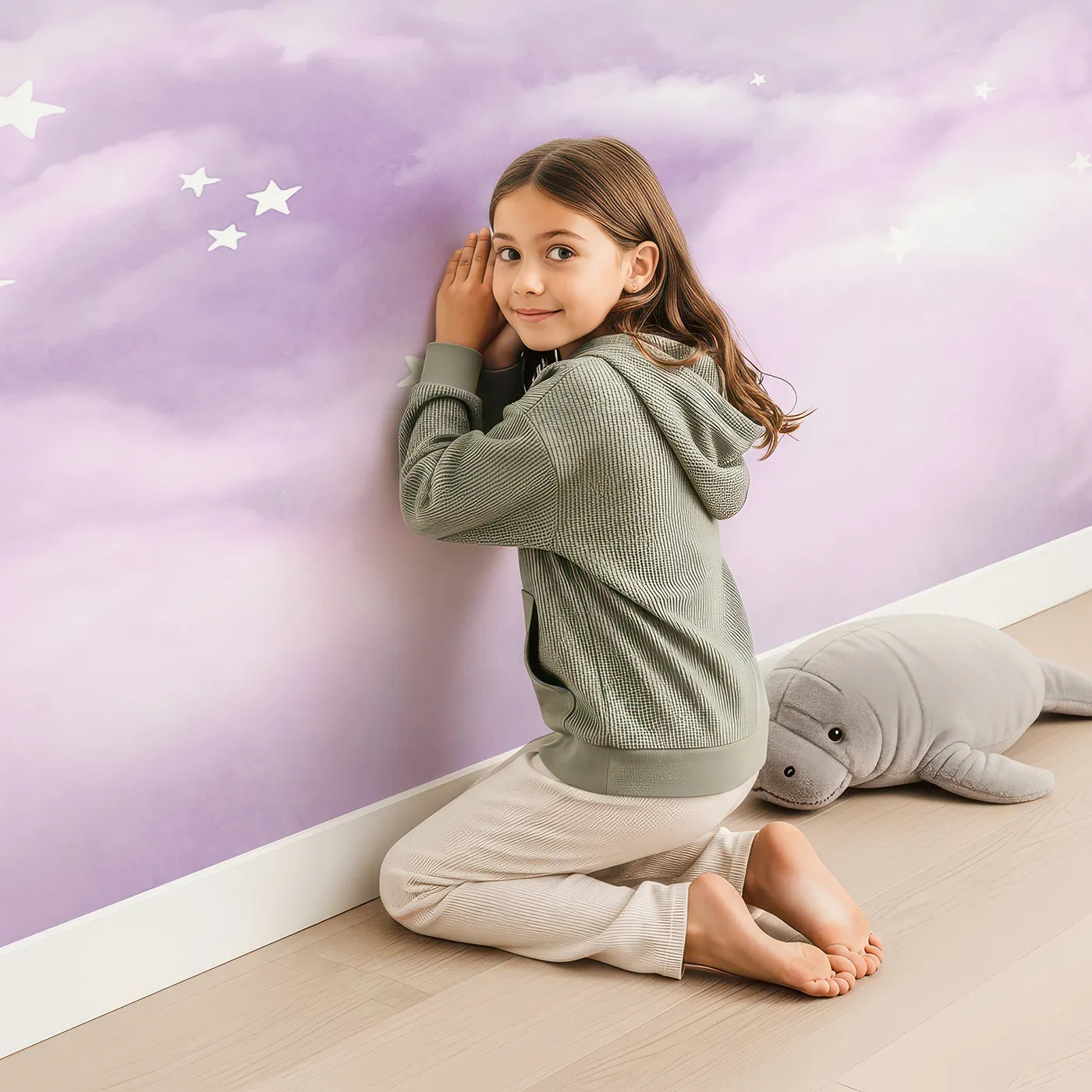 Child in front of Whimsy Tots Pastel Rainbow Clouds Wall Mural with rainbow, pastel, cloud, sky, purple, star, soft, dreamy in design.