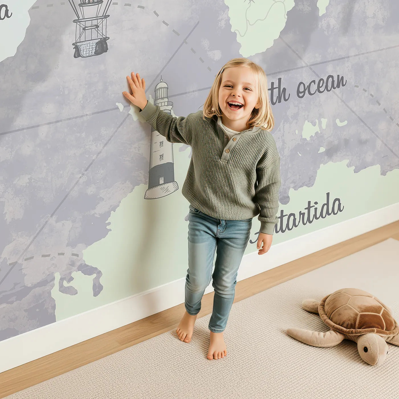 Child in front of Whimsy Tots Vintage World Map Wall Mural in Gray with map, world, vintage, animal, travel, educational, ship, gray in design.