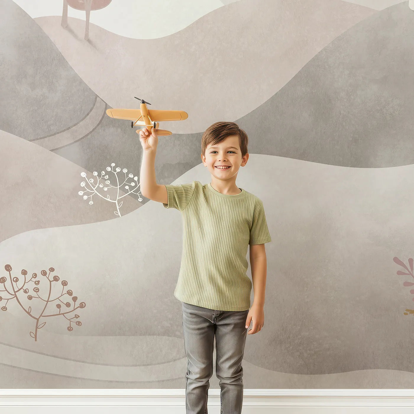 Child in front of Whimsy Tots Minimalist Brown Hills Wall Mural with landscape, abstract, minimalist, brown, beige, hill, tree, modern in design.