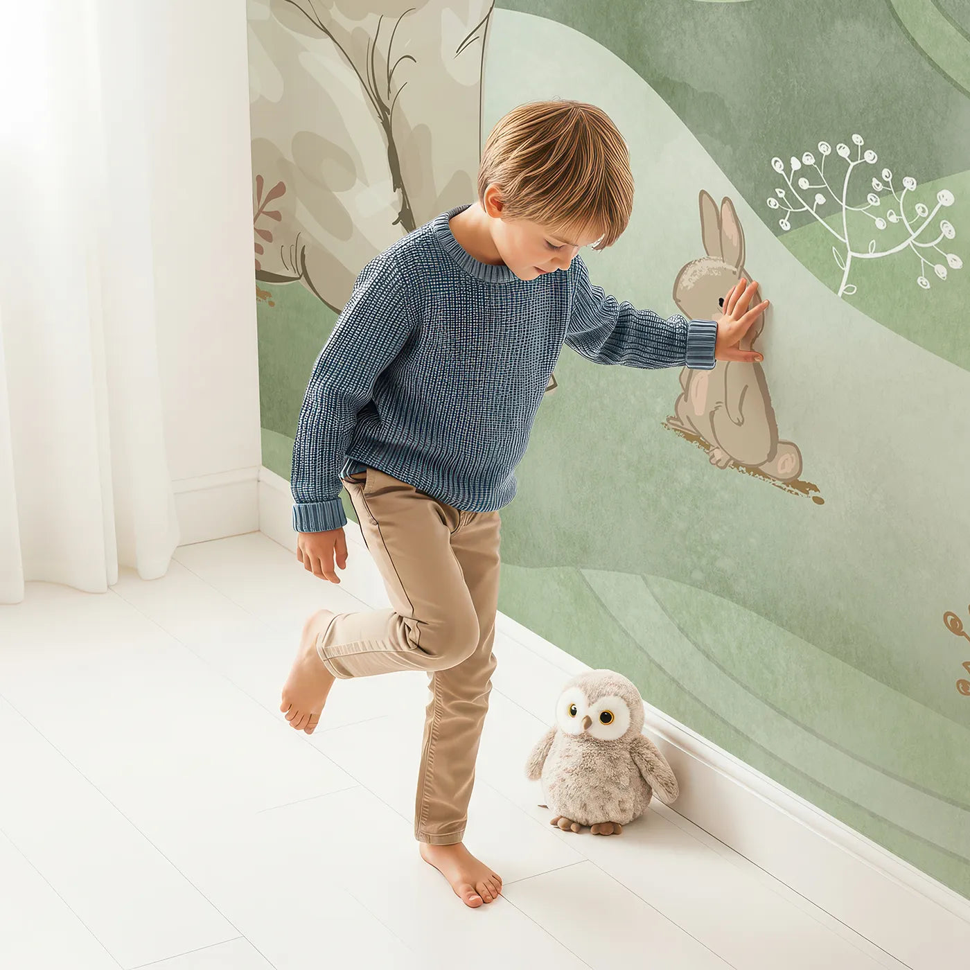 Child in front of Whimsy Tots Elephant and Friends Playtime Wall Mural with elephant, rabbit, cute, whimsical, animal, green, landscape, storybook in design.