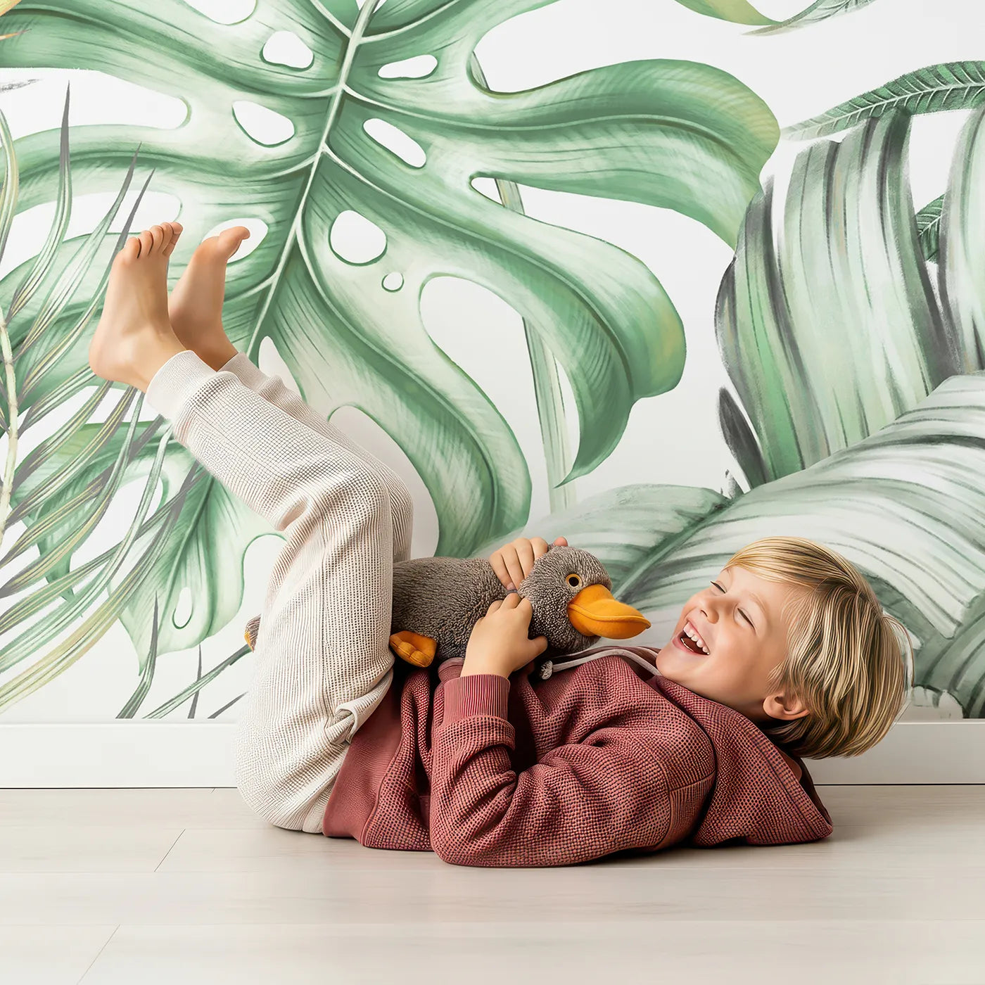 Child in front of Whimsy Tots Tropical Garden with Hummingbird Wall Mural with jungle, tropical, hummingbird, flower, bird of paradise, vibrant, realistic, leaf in design.