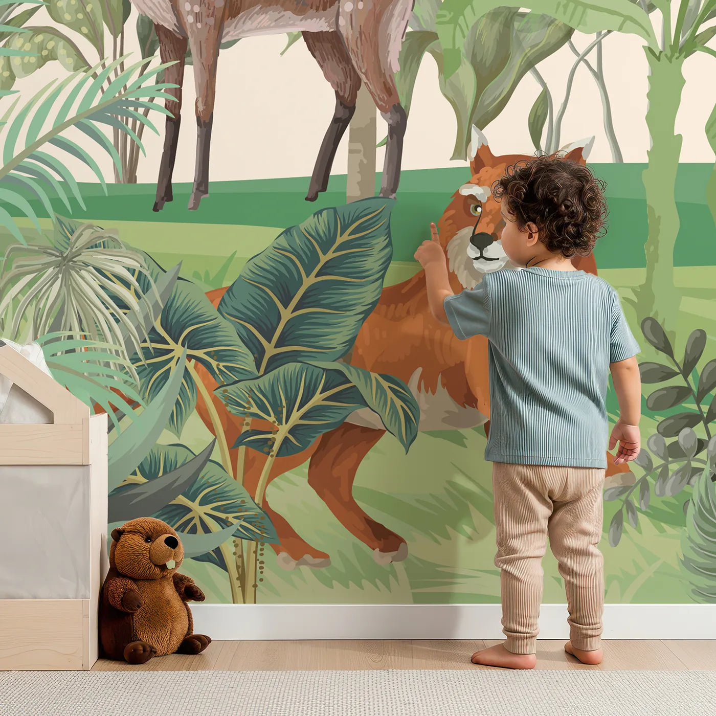 Child in front of Whimsy Tots Jungle Gathering Wall Mural with safari, jungle, animal, realistic, elephant, lion, deer, fox in design.