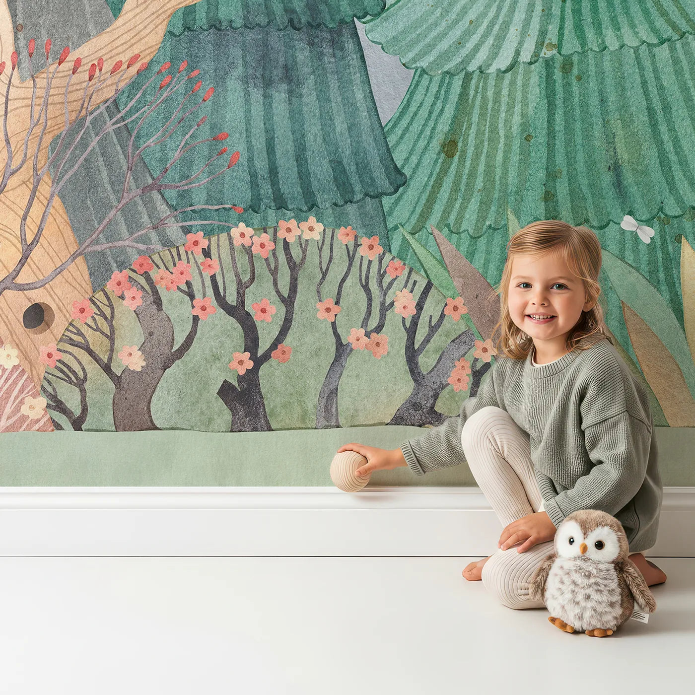 Child in front of Whimsy Tots Whimsical Forest Border Wall Mural with forest, tree, watercolor, whimsical, landscape, mountain, cute, artistic in design.