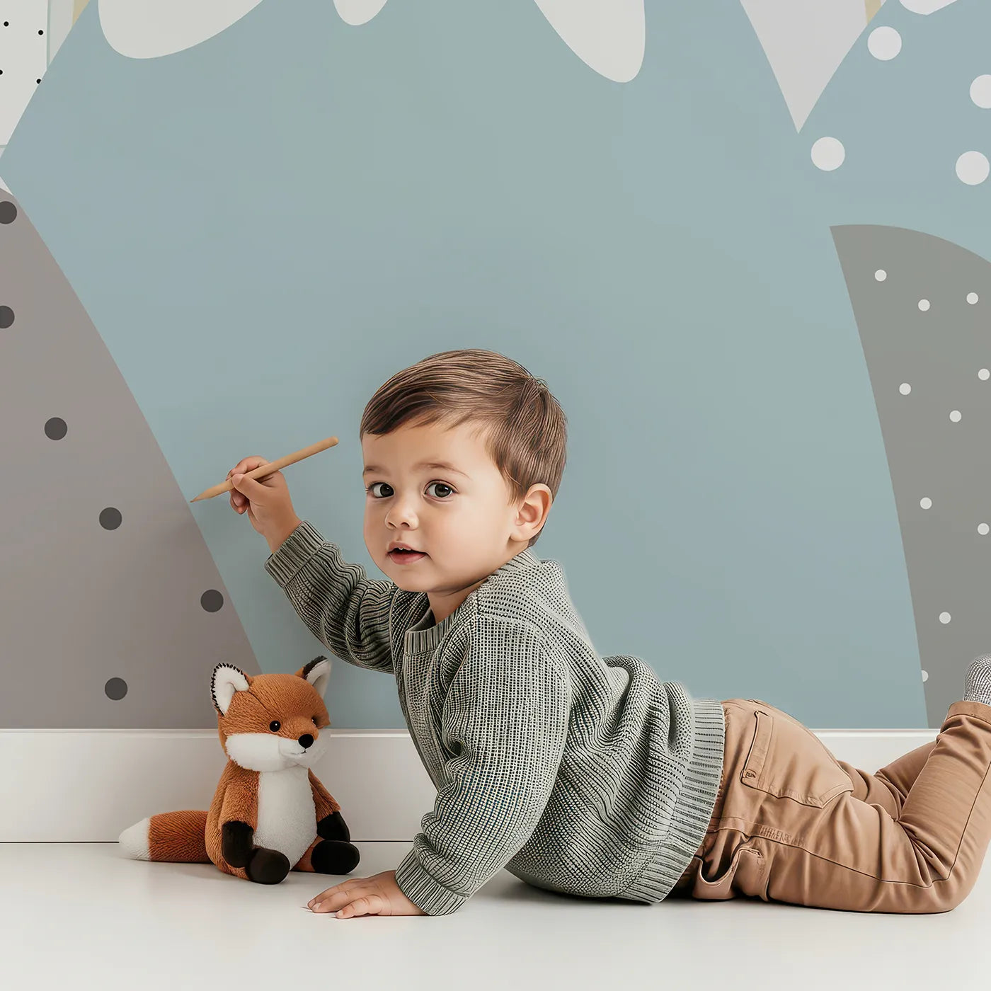 Child in front of Whimsy Tots Boho Rainbow Mountains Wall Mural with mountain, rainbow, boho, abstract, minimalist, gray, blue, modern in design.