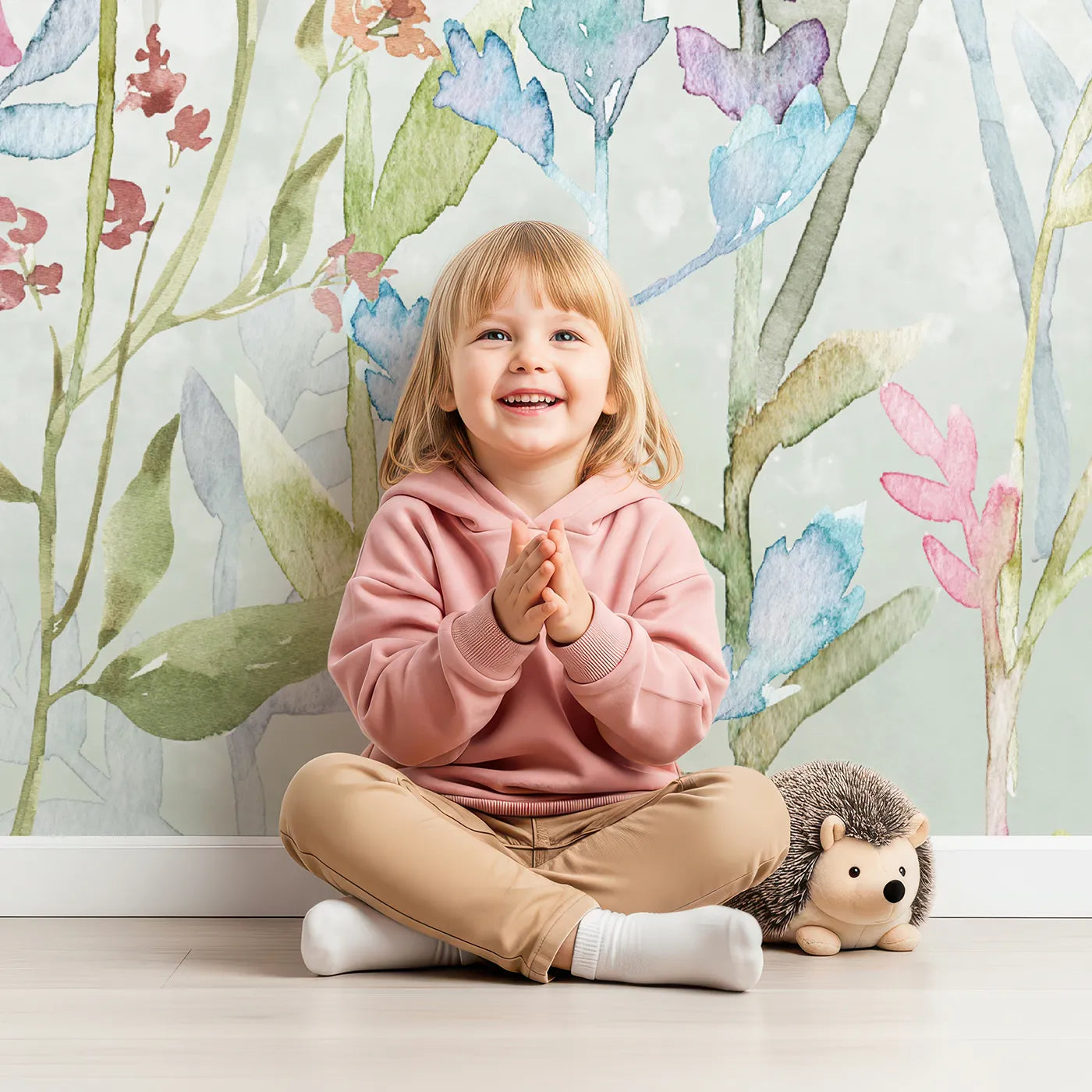 Child in front of Whimsy Tots Watercolor Wildflower Border Wall Mural in Color with flower, wildflower, watercolor, floral, pattern, colorful, pastel, botanical in design.