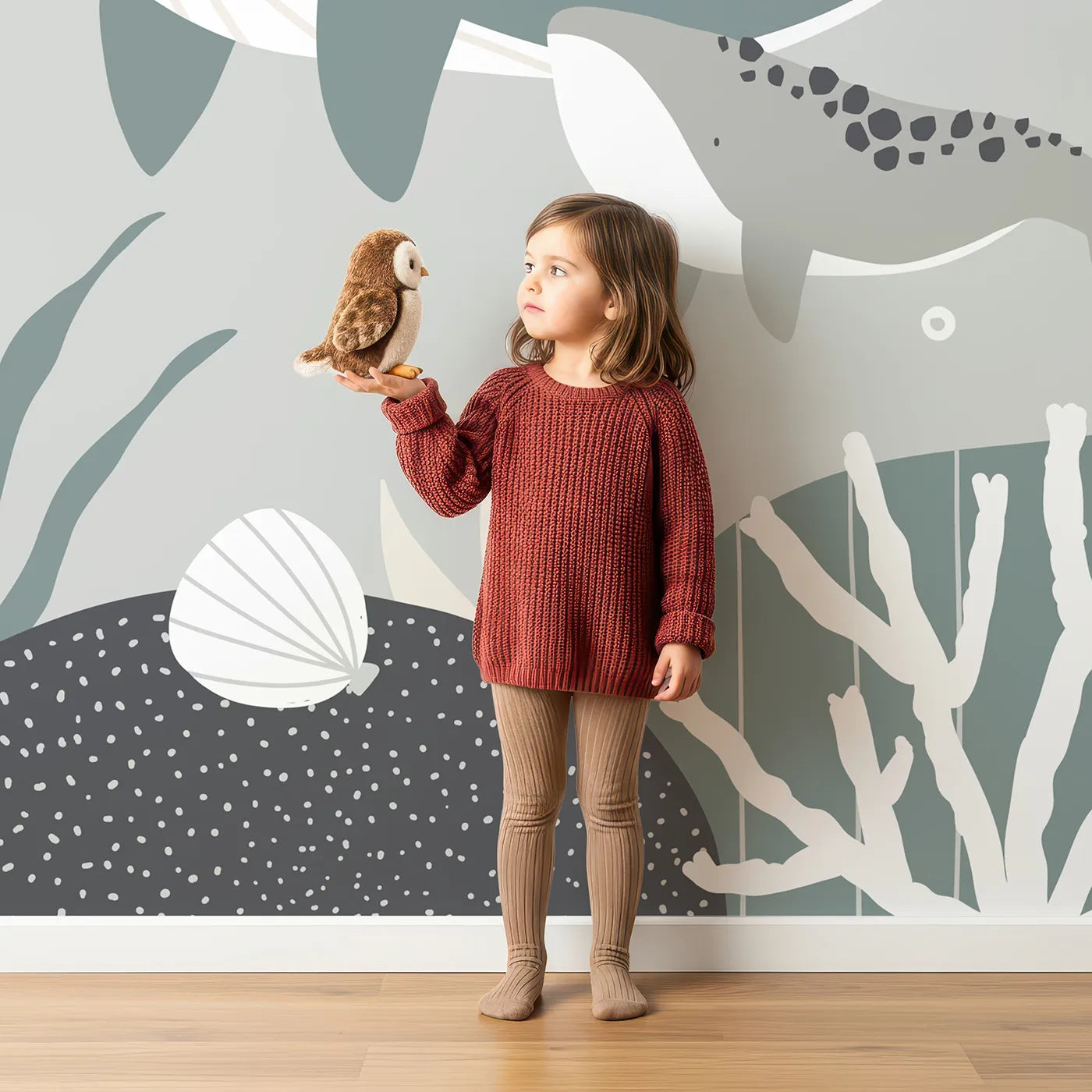 Child in front of Whimsy Tots Whale and Sailboat Wall Mural with whale, sea, ocean, abstract, minimalist, gray, green, boat in design.