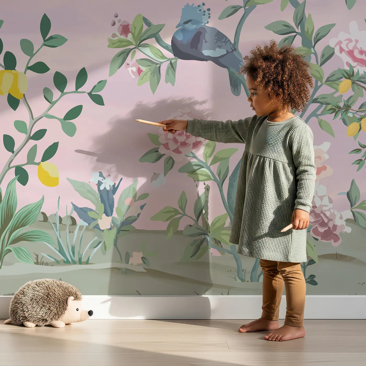Child in front of Whimsy Tots Parrot and Lemon Tree Garden Wall Mural with chinoiserie, vintage, floral, bird, parrot, lemon, pink, classic in design.