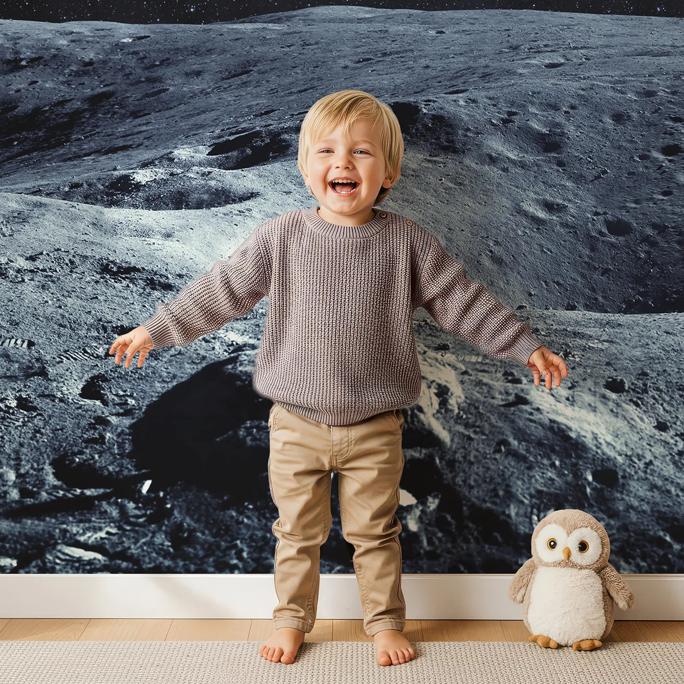 Child in front of Whimsy Tots Astronaut on the Moon Wall Mural with astronaut, moon, space, realistic, science, cosmos, stars, crater in design.