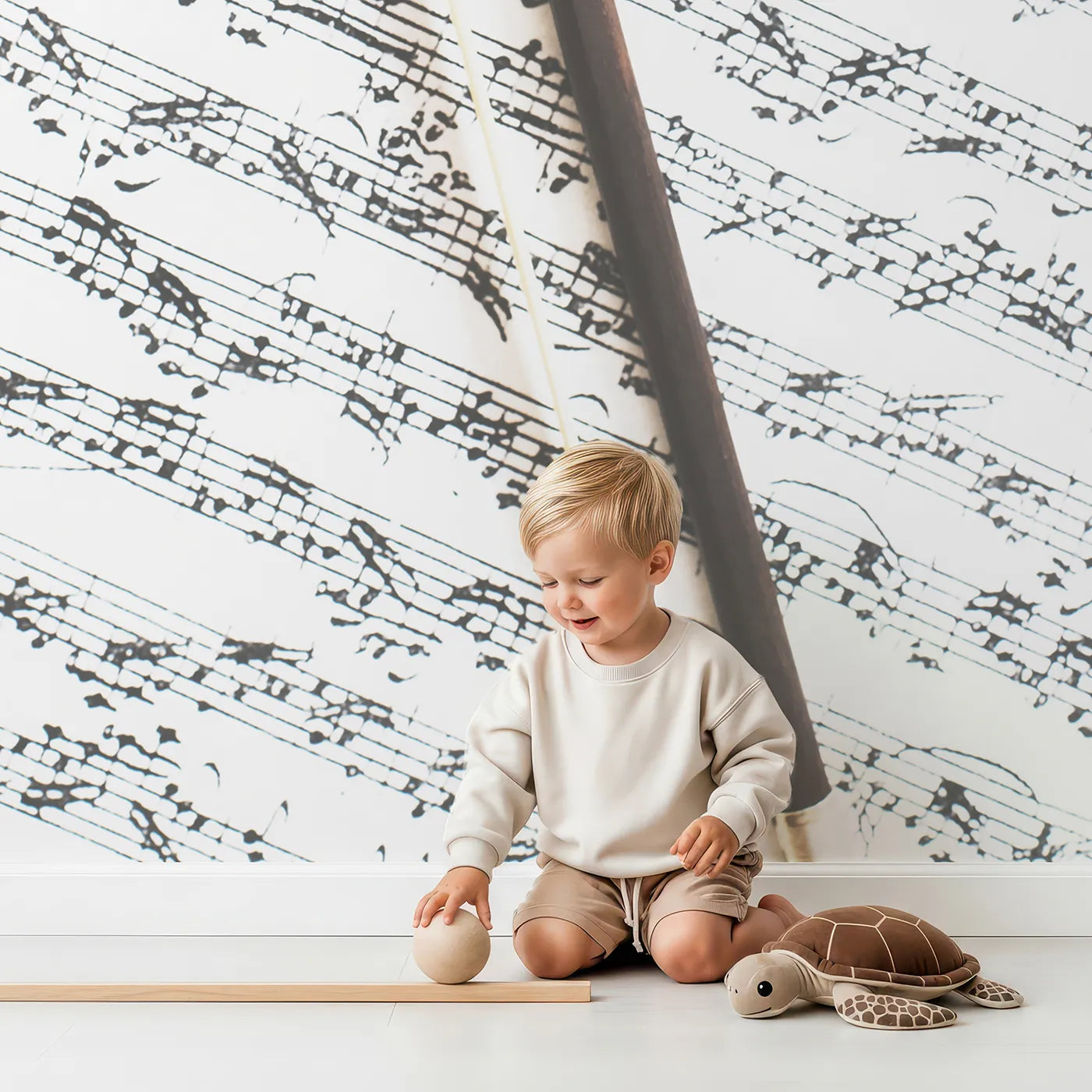 Child in front of Whimsy Tots Vintage Violin Wall Mural with music, violin, vintage, sheet music, classical, instrument, art, brown in design.