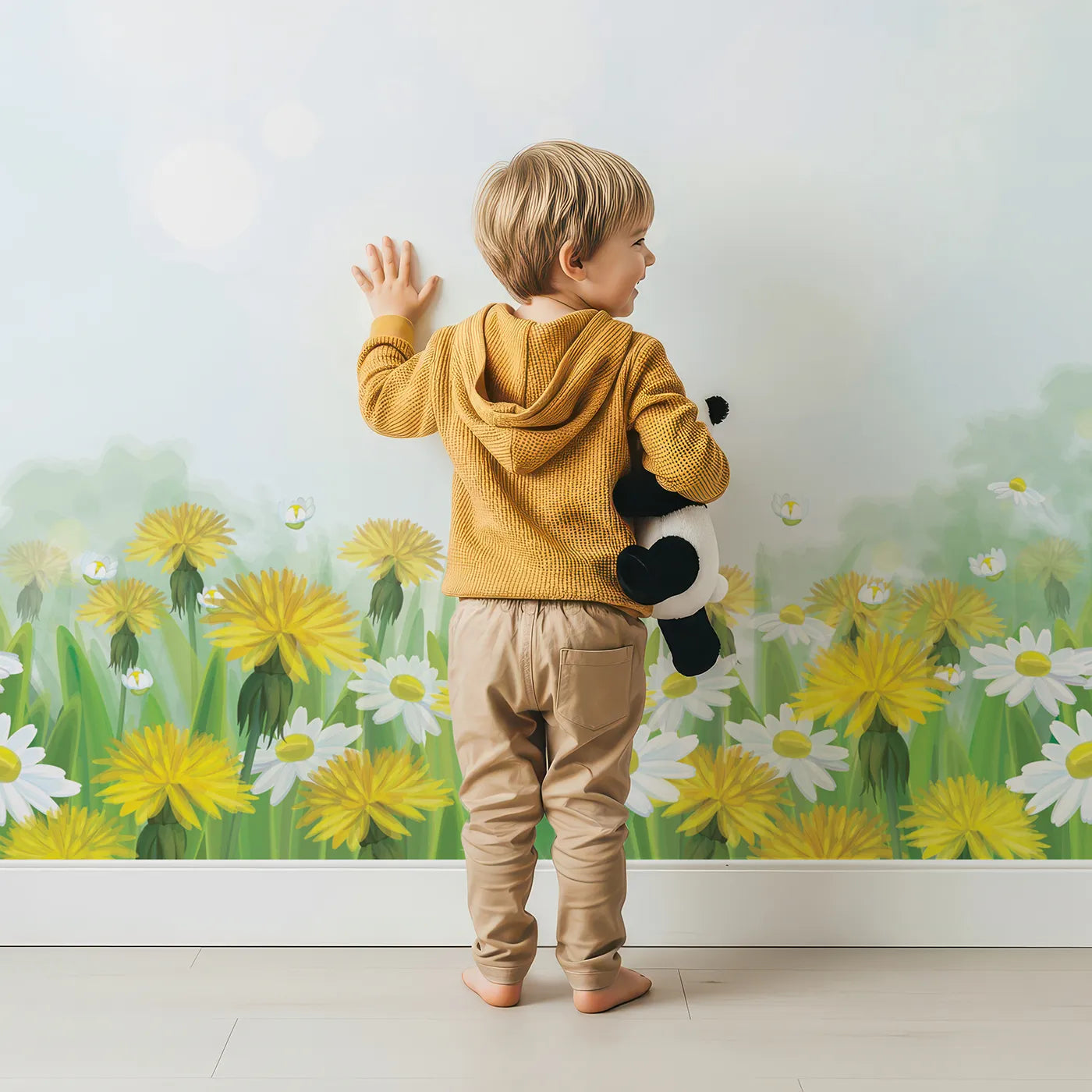Child in front of Whimsy Tots Dandelion Wishes Wall Mural in Green with dandelion, seed, flower, wish, wind, grass, nature in design.