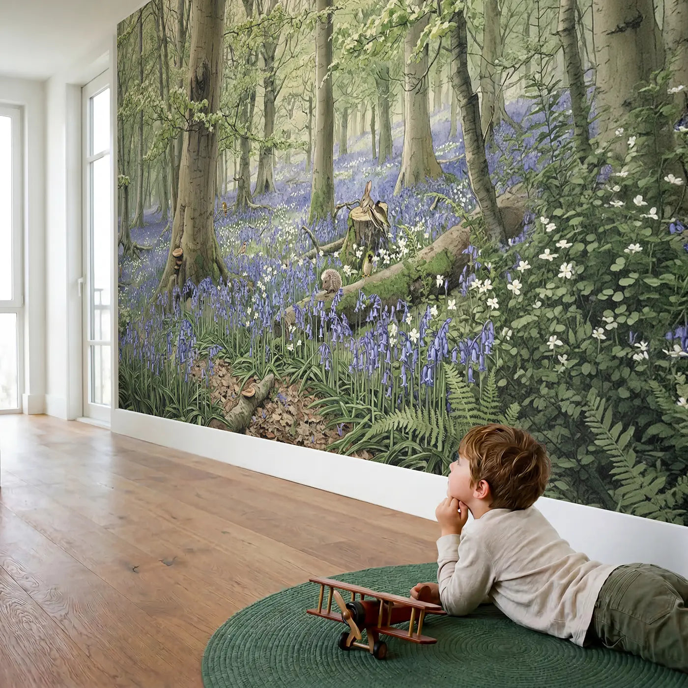 Child in nursery with Bluebell Woodland Floor Wallpaper Mural by Whimsy Tots