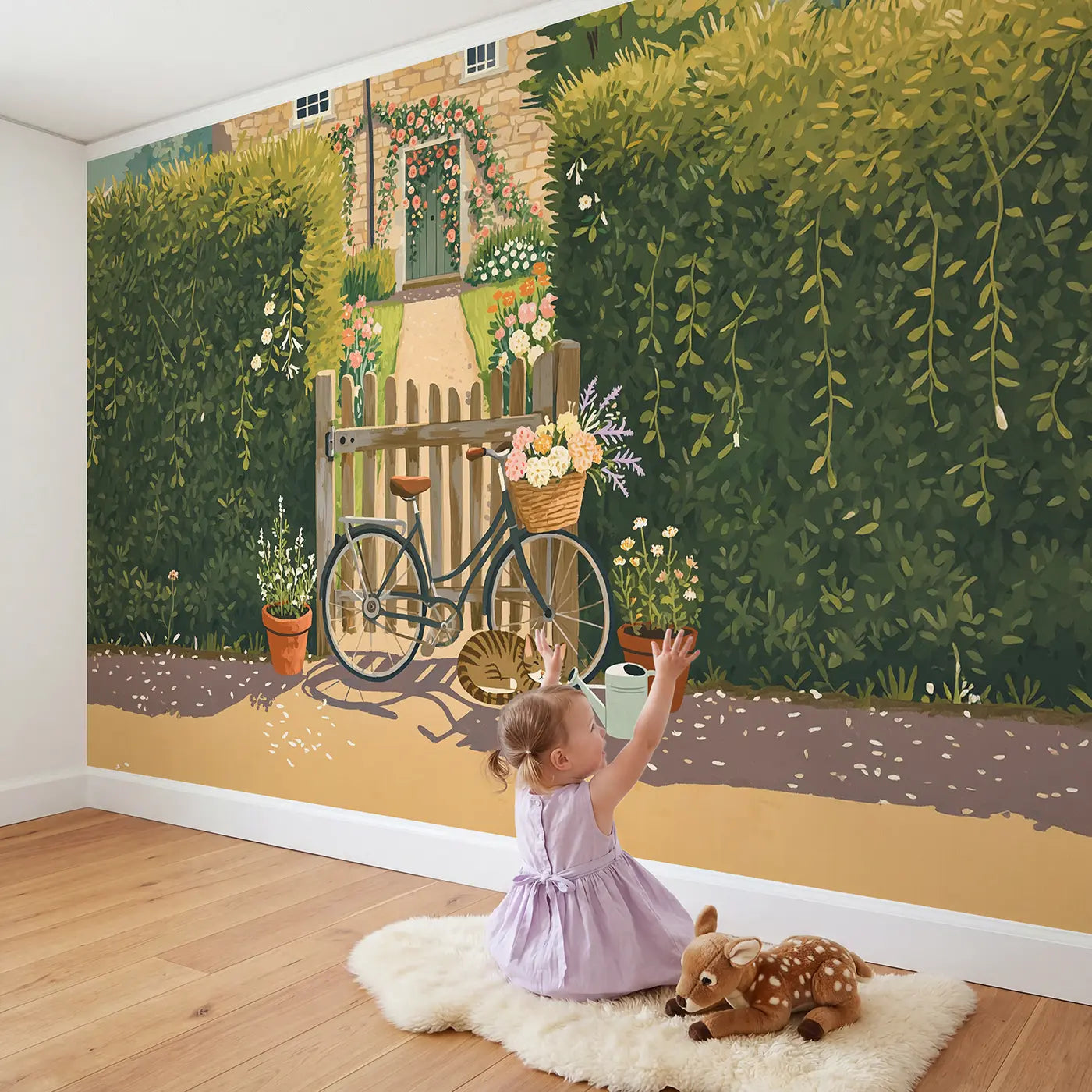 Child in nursery with Garden Gate Bicycle Wallpaper Mural by Whimsy Tots