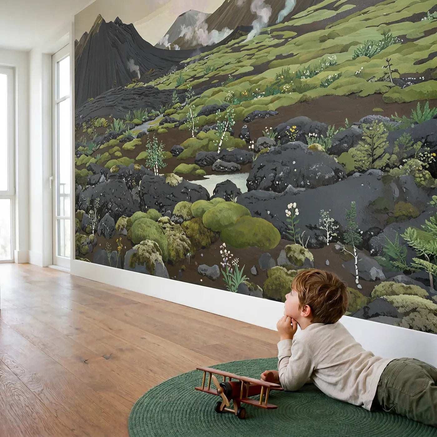 Child in nursery with Volcanic Green Recovery Wallpaper Mural by Whimsy Tots