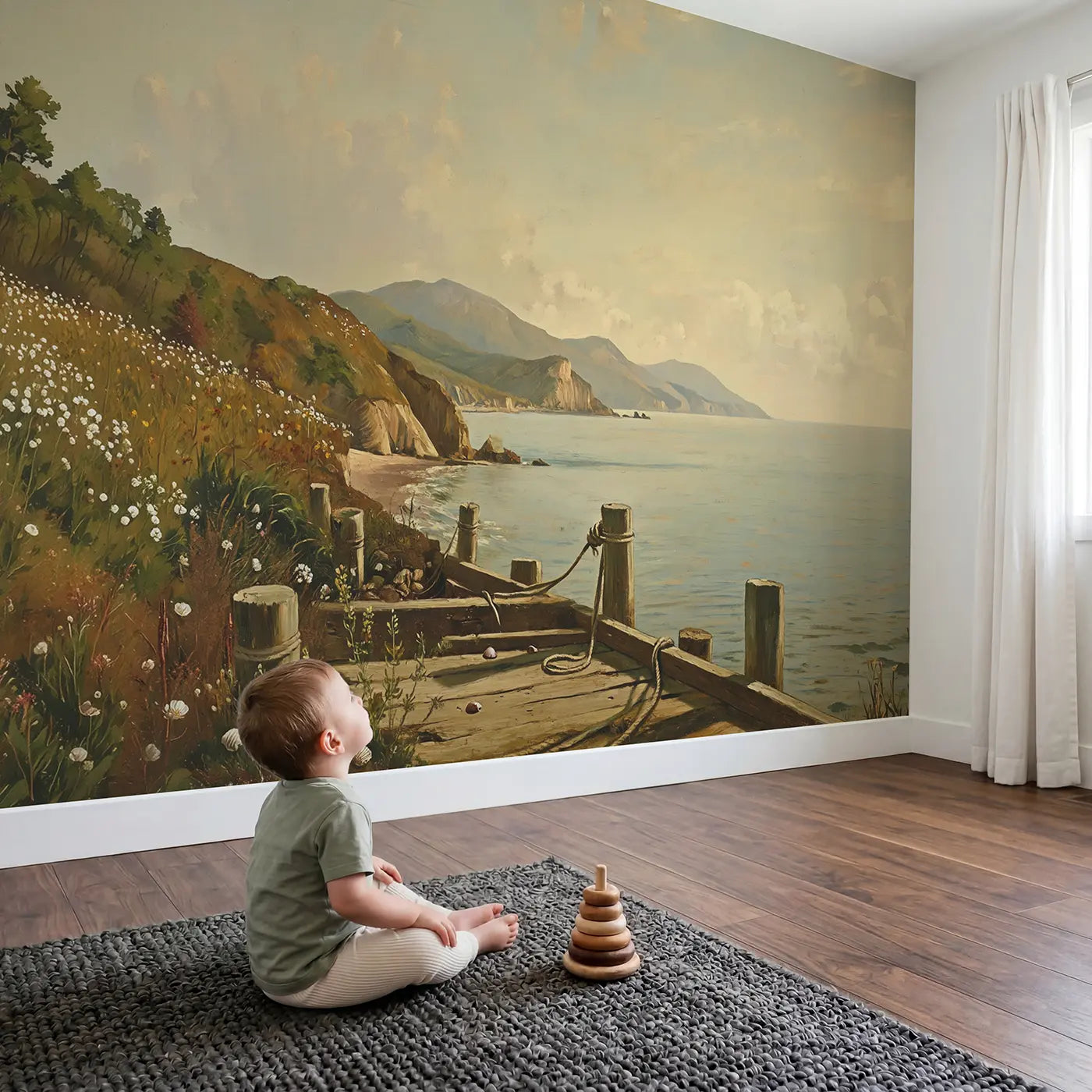 Child in nursery with Coastal Mountains Meeting Ocean Wallpaper Mural by Whimsy Tots