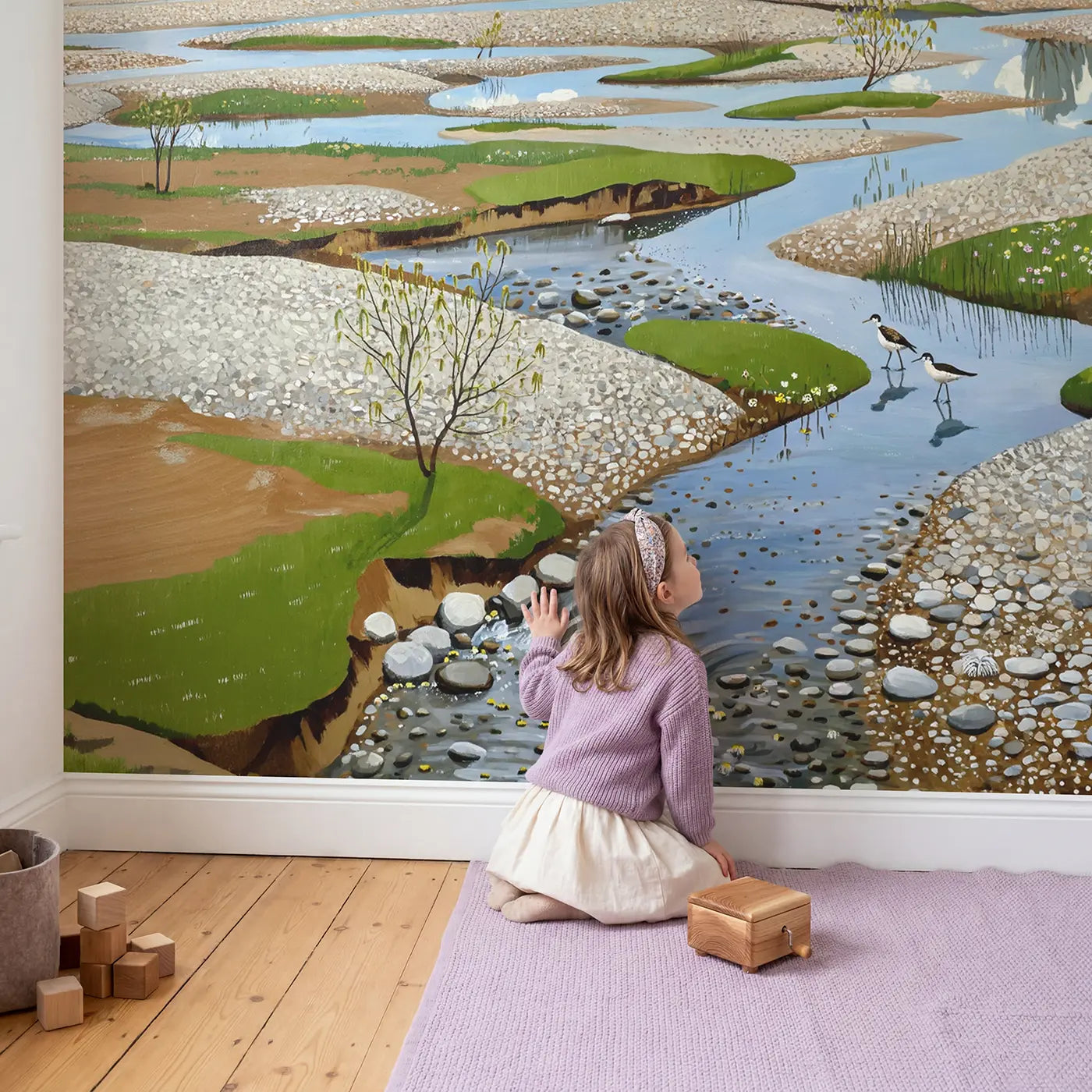 Child in nursery with Mountain Melt River Braiding Wallpaper Mural by Whimsy Tots