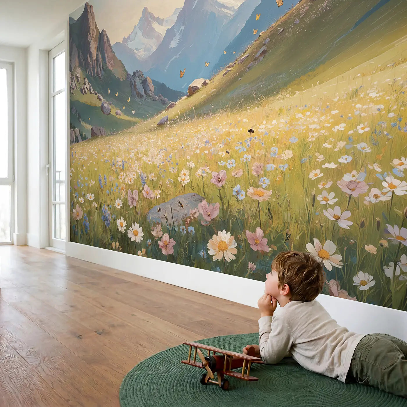 Child in nursery with Alpine Meadow and Peaks Wallpaper Mural by Whimsy Tots